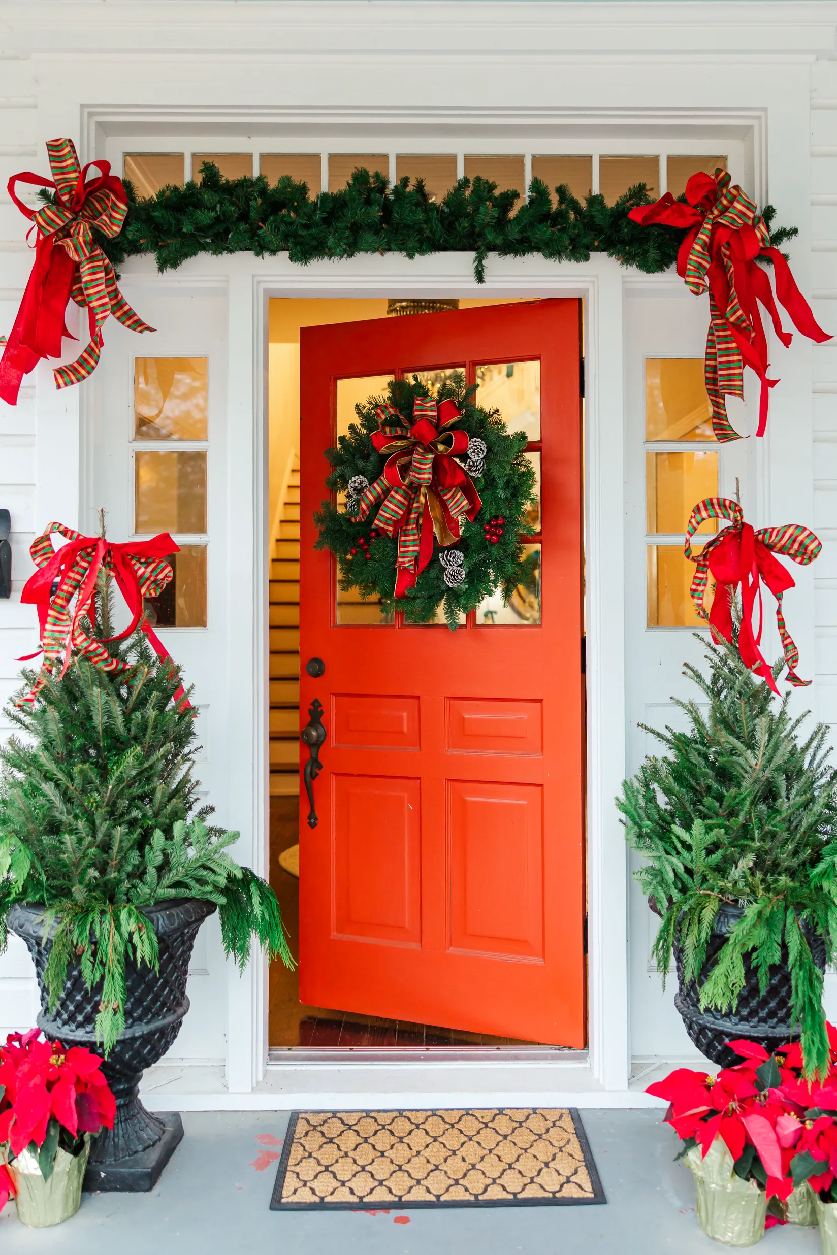 Luxury table setting by Sarah Overall Events with pink embroidered napkins, gold-rimmed plates, floral arrangements, and personalized menus in Shreveport.