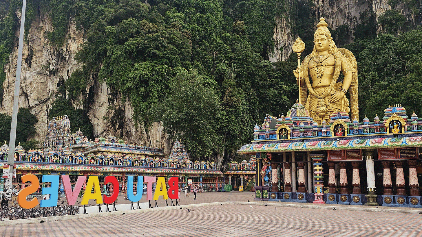 Direct view of Batu Caves with the huge golden Shiva statue. It is located in Kuala Lumpur, Malaysia.