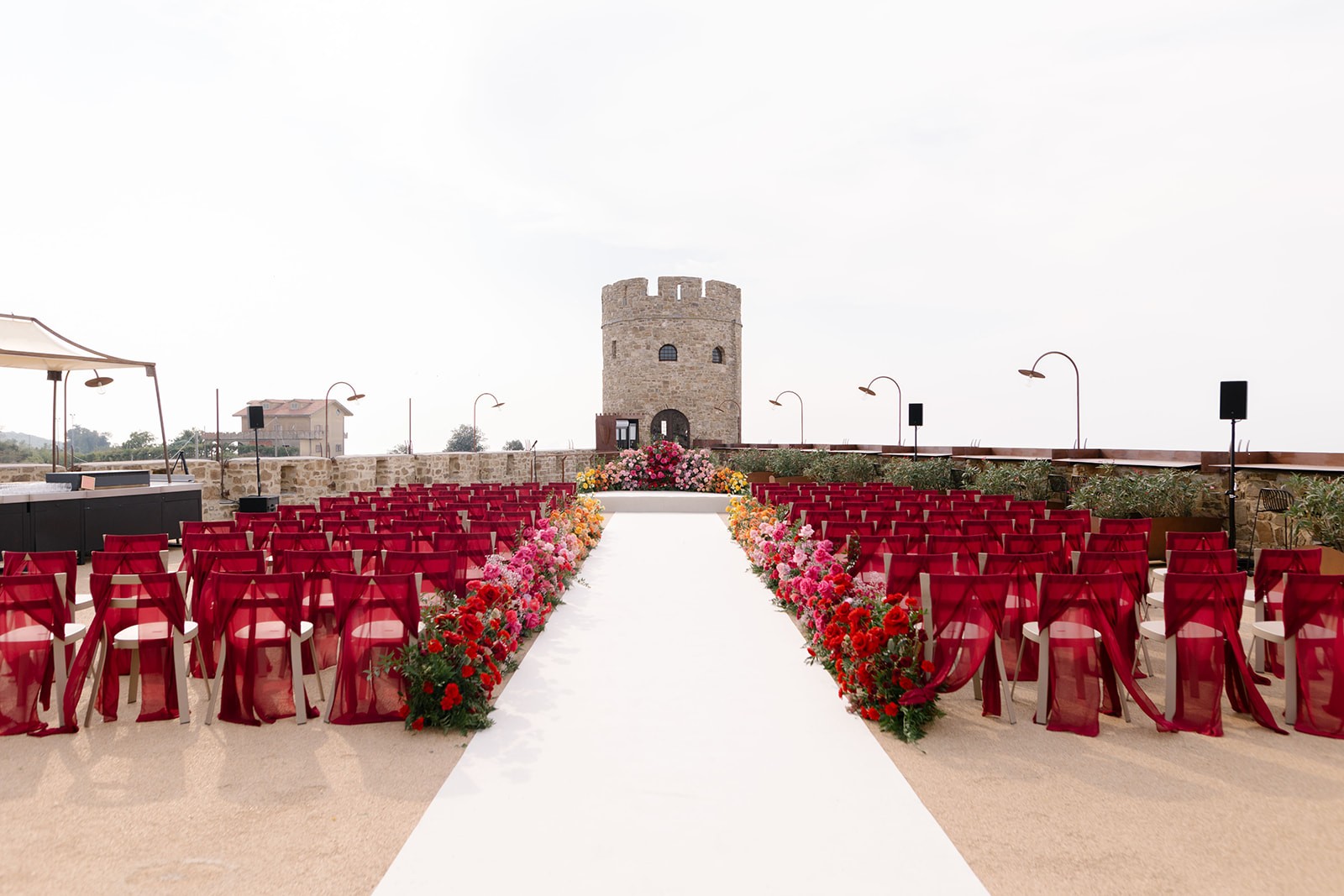 An elegantly decorated wedding venue is prepared.
