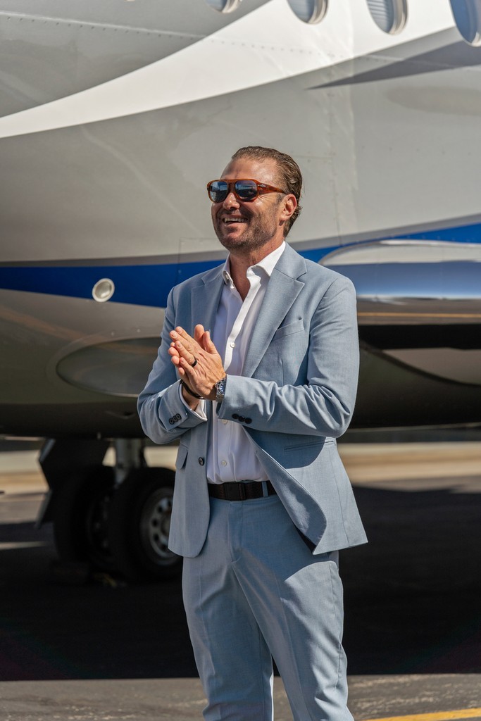 person sitting in a chair in front of a man