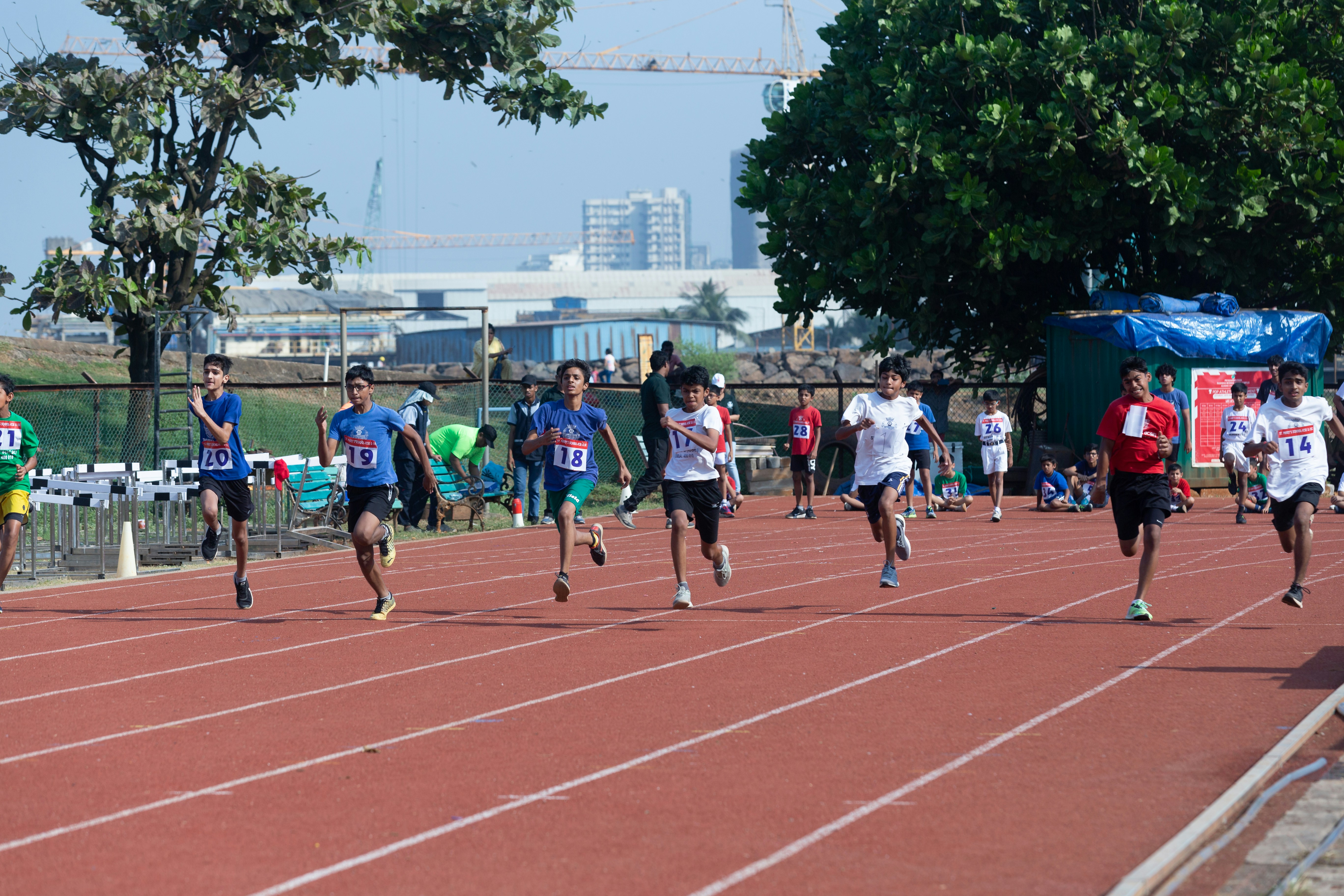 a group of people running on a track