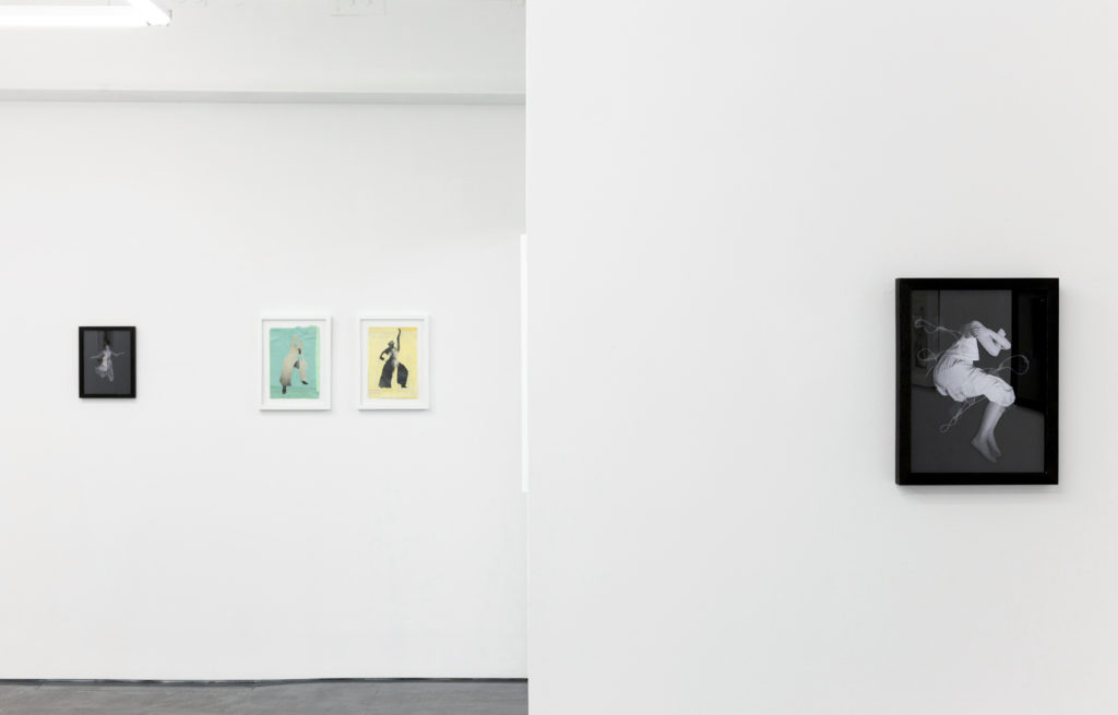 exhibition wall with hanged prints