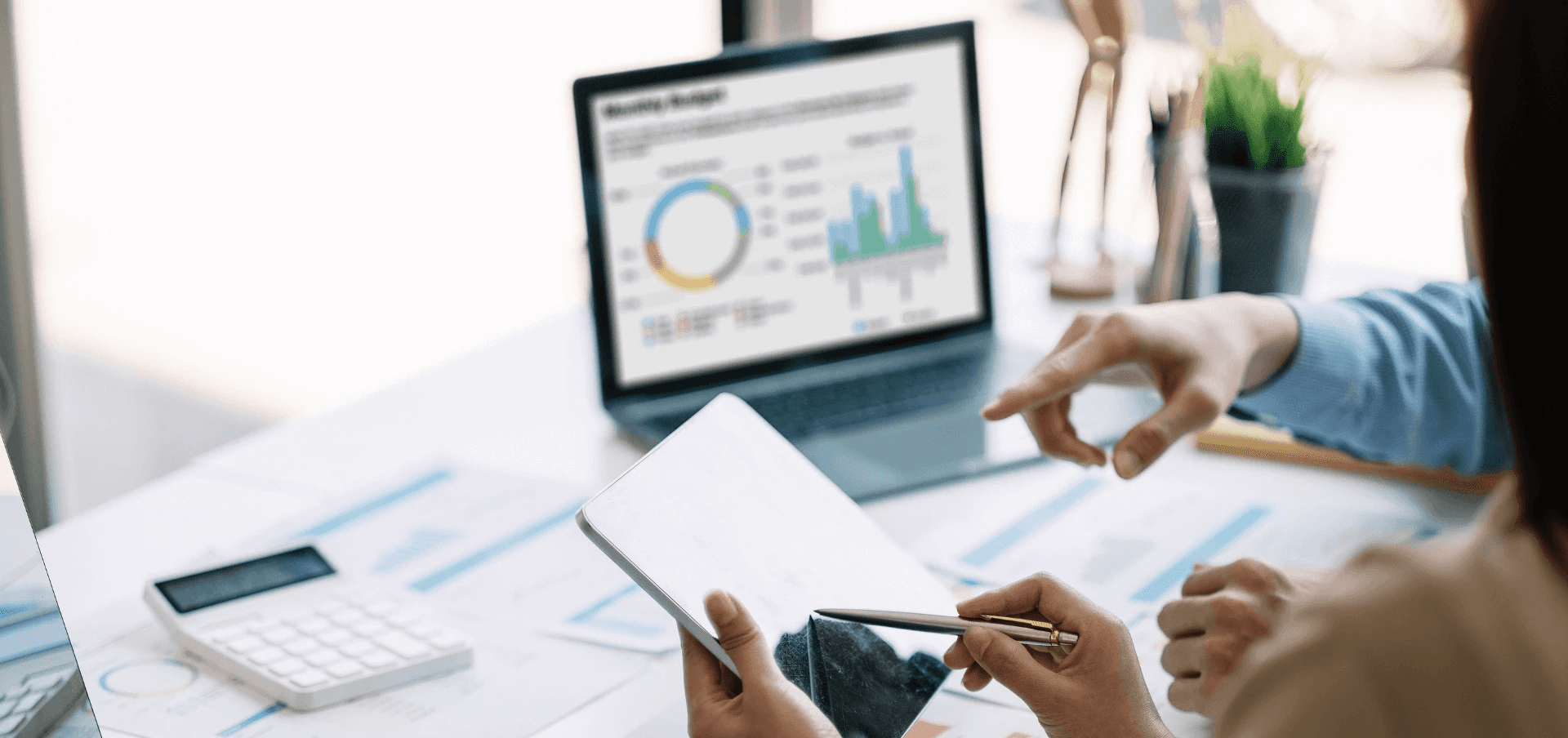 Colleagues reviewing data on tablet - Lead Qualification Best Practices