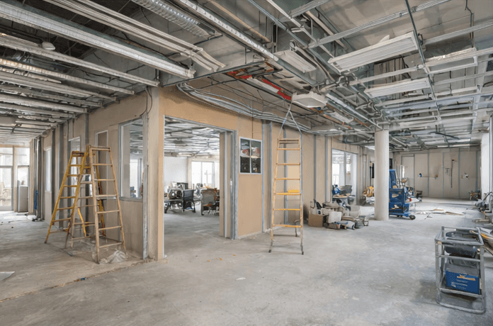 white and blue glass walled high rise building