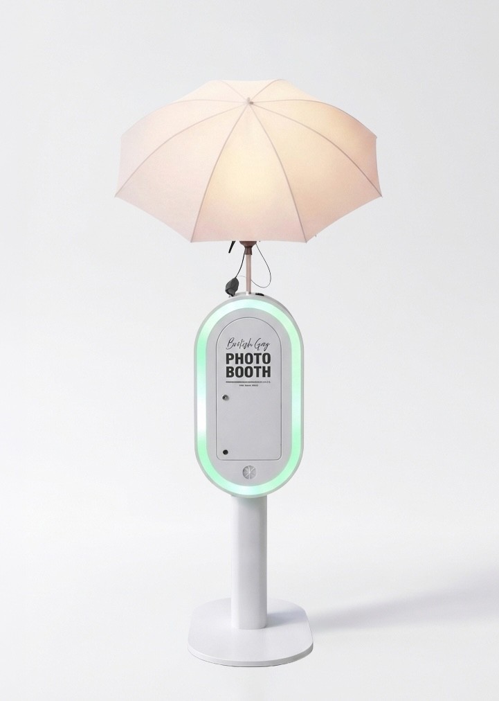 A couple stands outdoors at sunset.