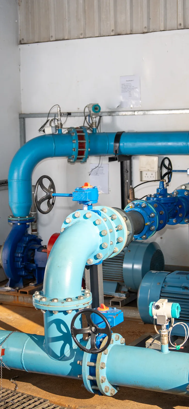 JOAT pump station pipework with valves, flow and pressure instrumentation and a Hydralytix monitoring screen