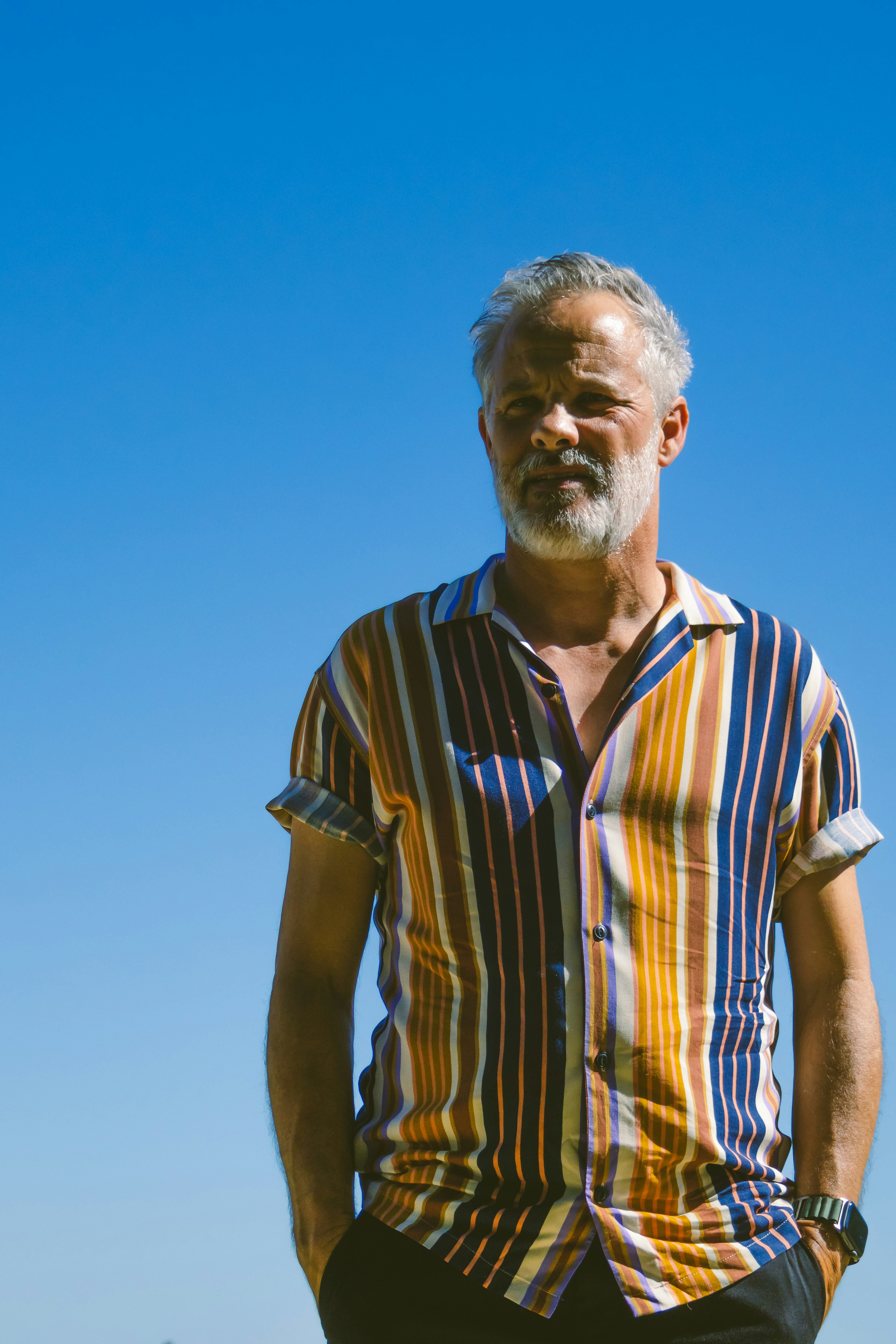 a man standing with his hands in his pockets