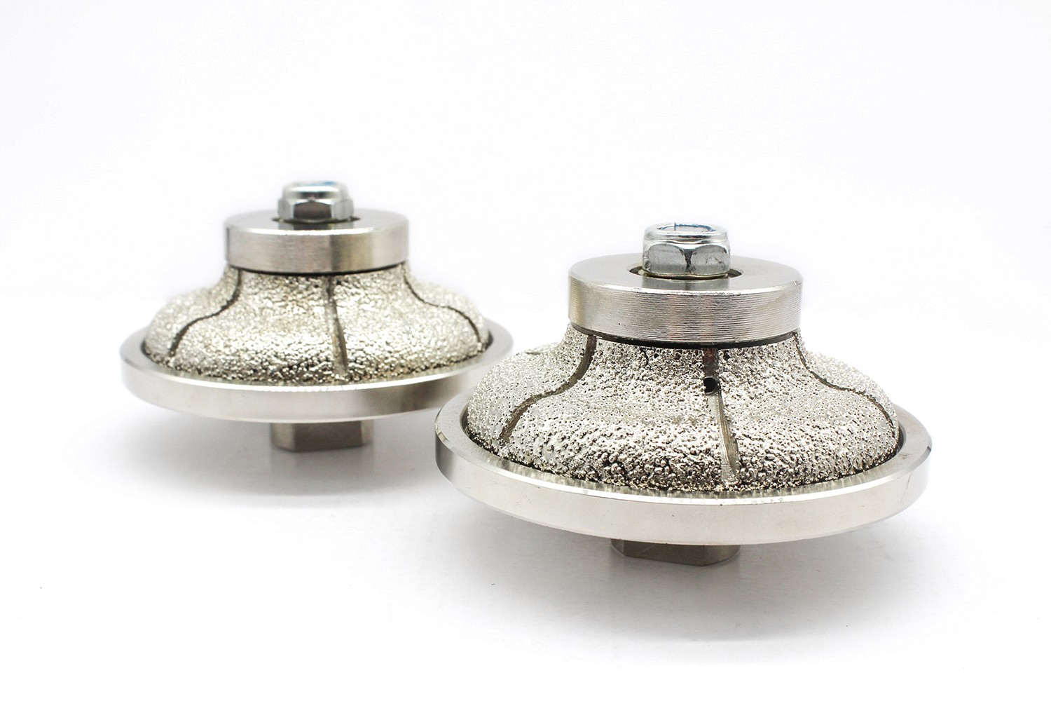 Two silver Diamond Profiling Wheels with a dome-shaped design, positioned to show front and side views.