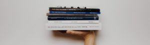 hand holding books