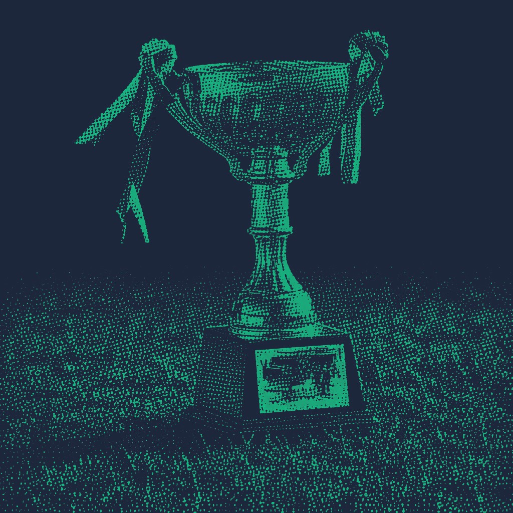 Half tone trophy sat on grass