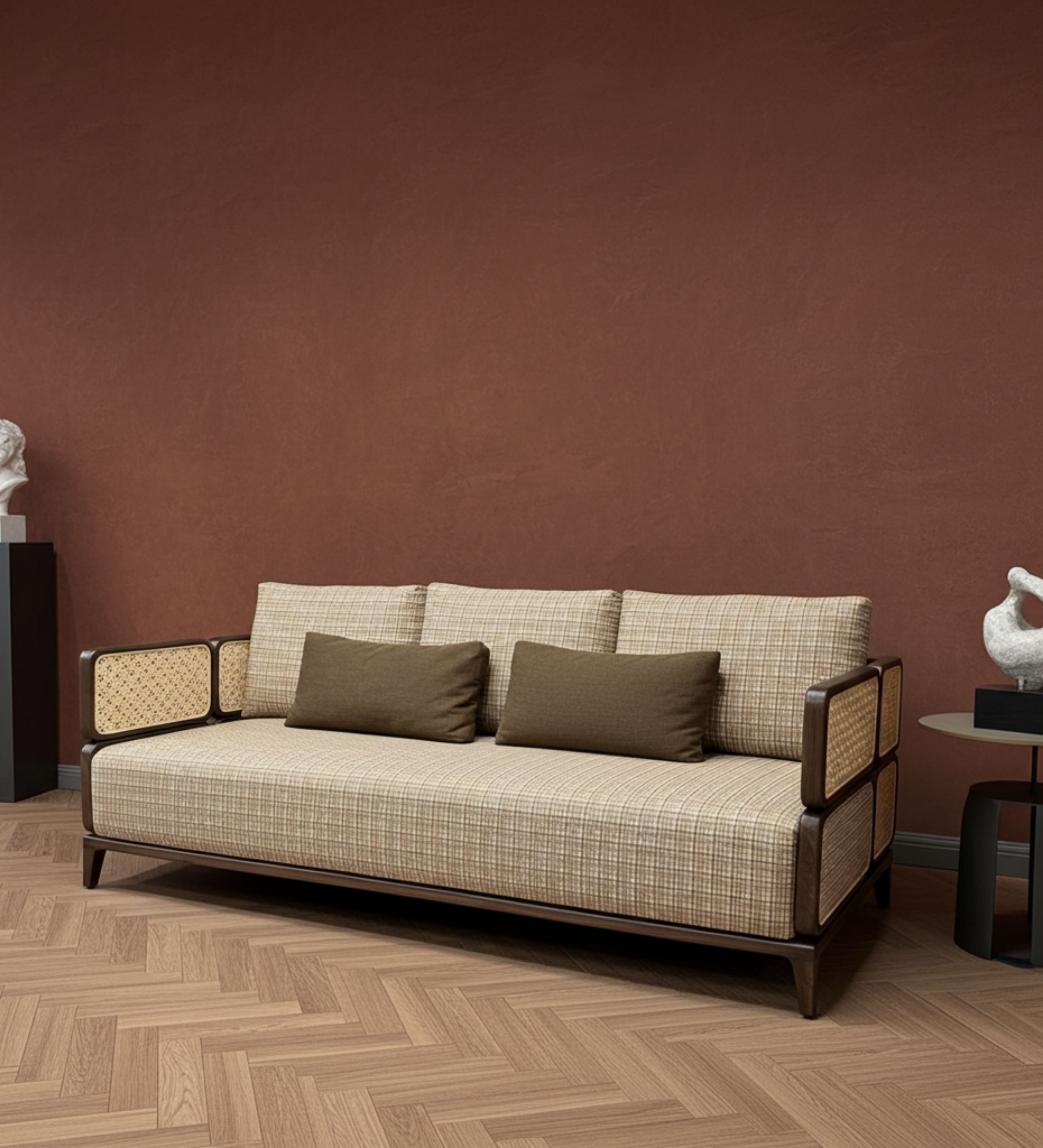 Boxy fabric seating with woven cane side panels and layered cushion arrangement