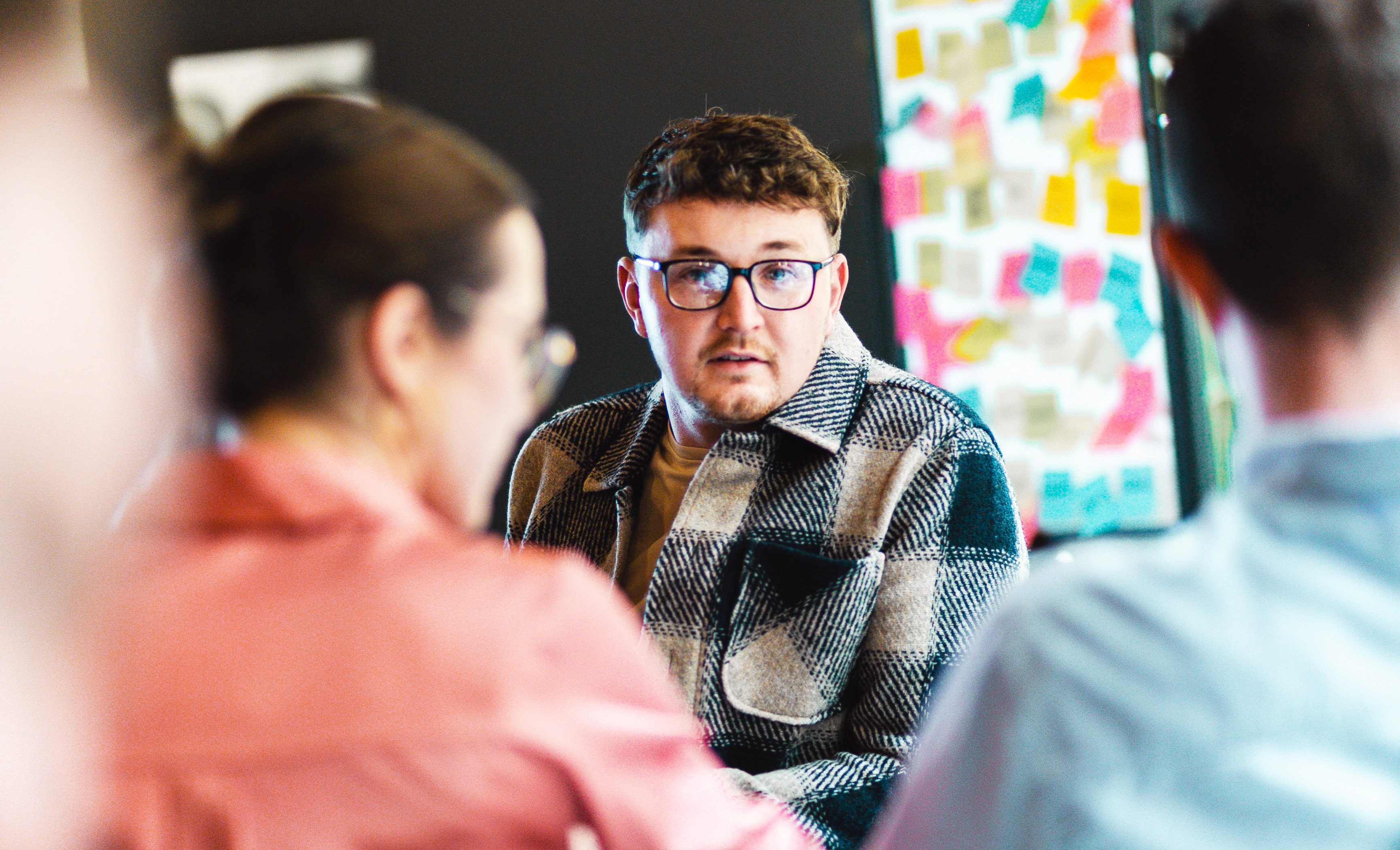 Team members in discussion during a meeting.