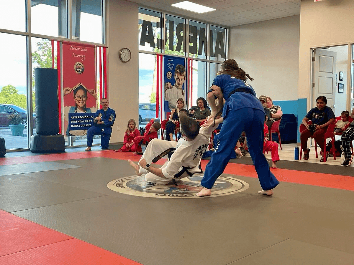 Student perform a throw in a self defense practice.