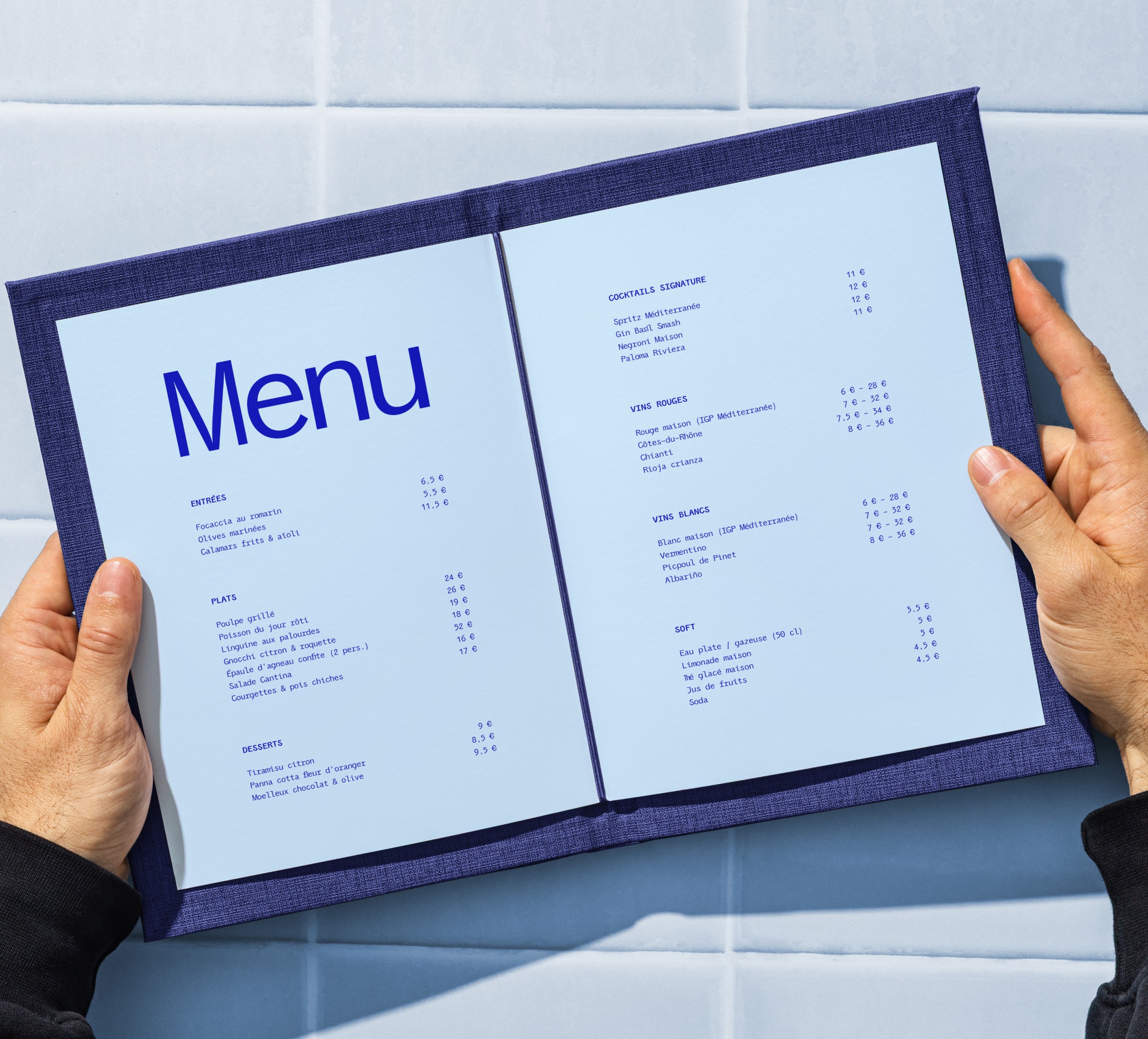 Minimalist coffee can design in hand – black and white packaging with bold typography