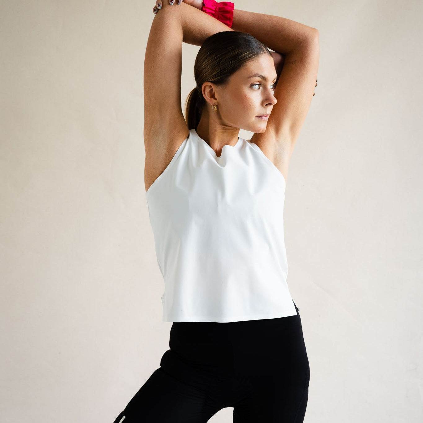 Cyclist in LUCA Meander vest in white, arms raised showing relaxed fit