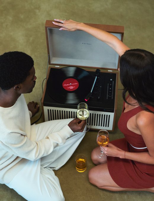 Two friends choosing a record
