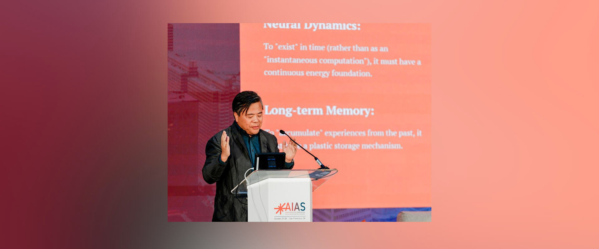 A fast black sports car races down the highway.