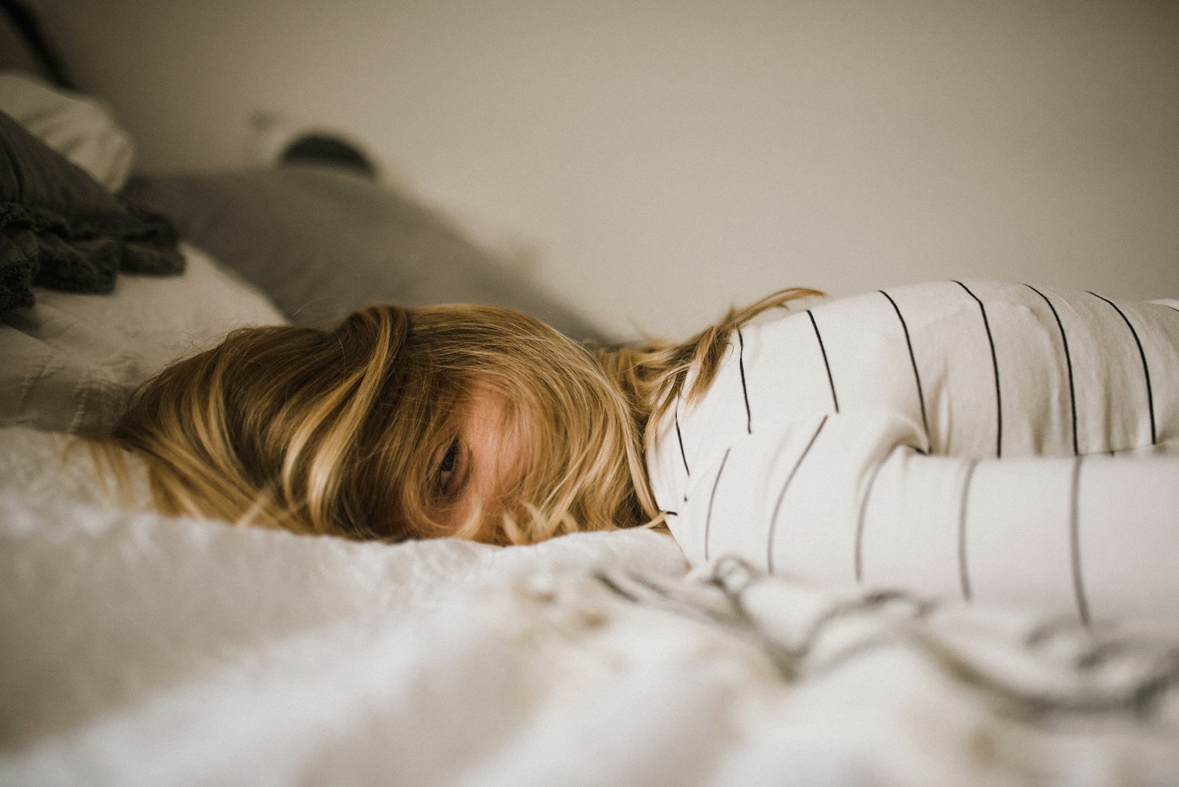 woman trying to sleep - How to Fix Forward Head Posture