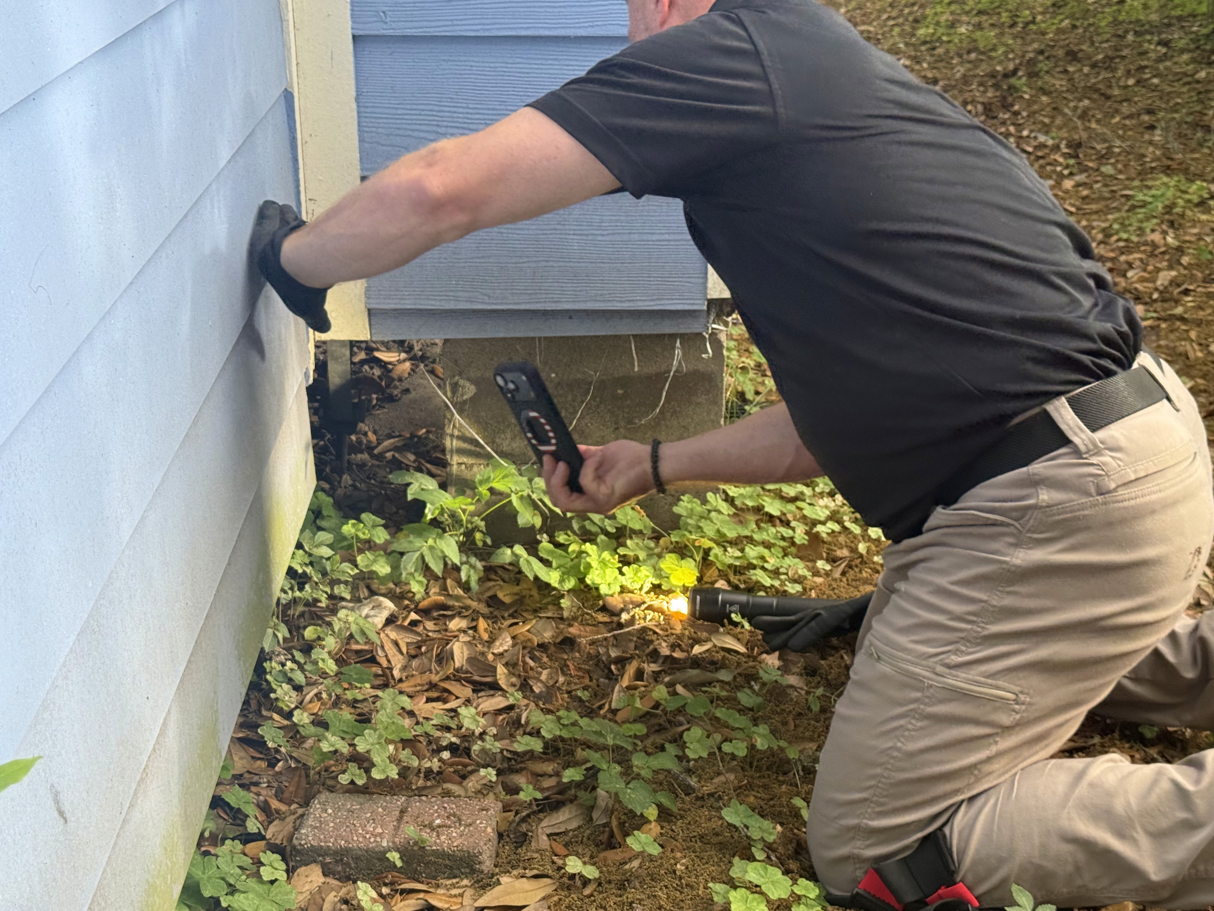 home inspector inspecting house in Covington Louisiana