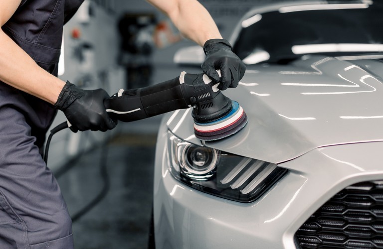 Mechanic repairing car engine.