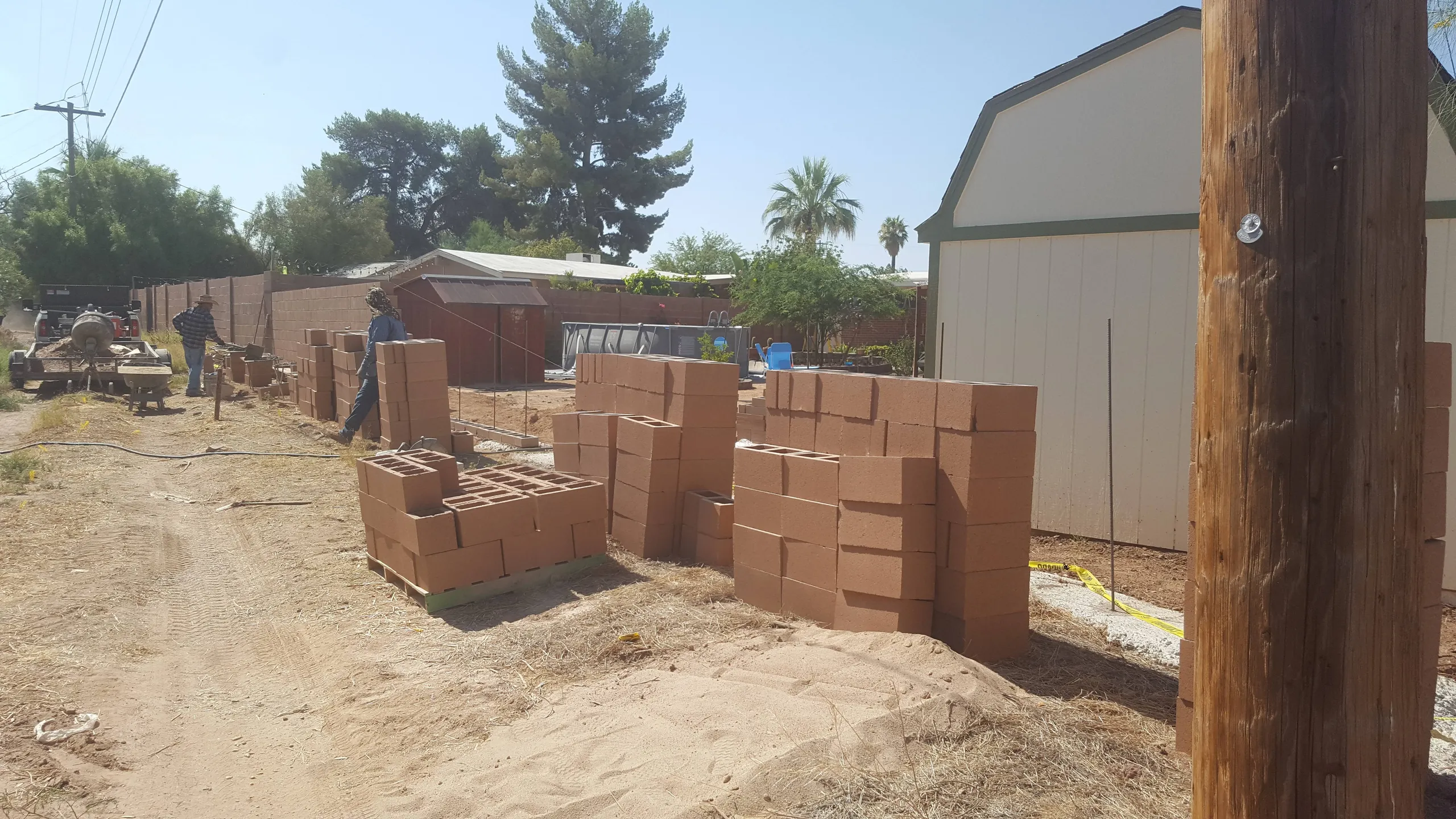Before: block privacy wall under construction in Tucson
