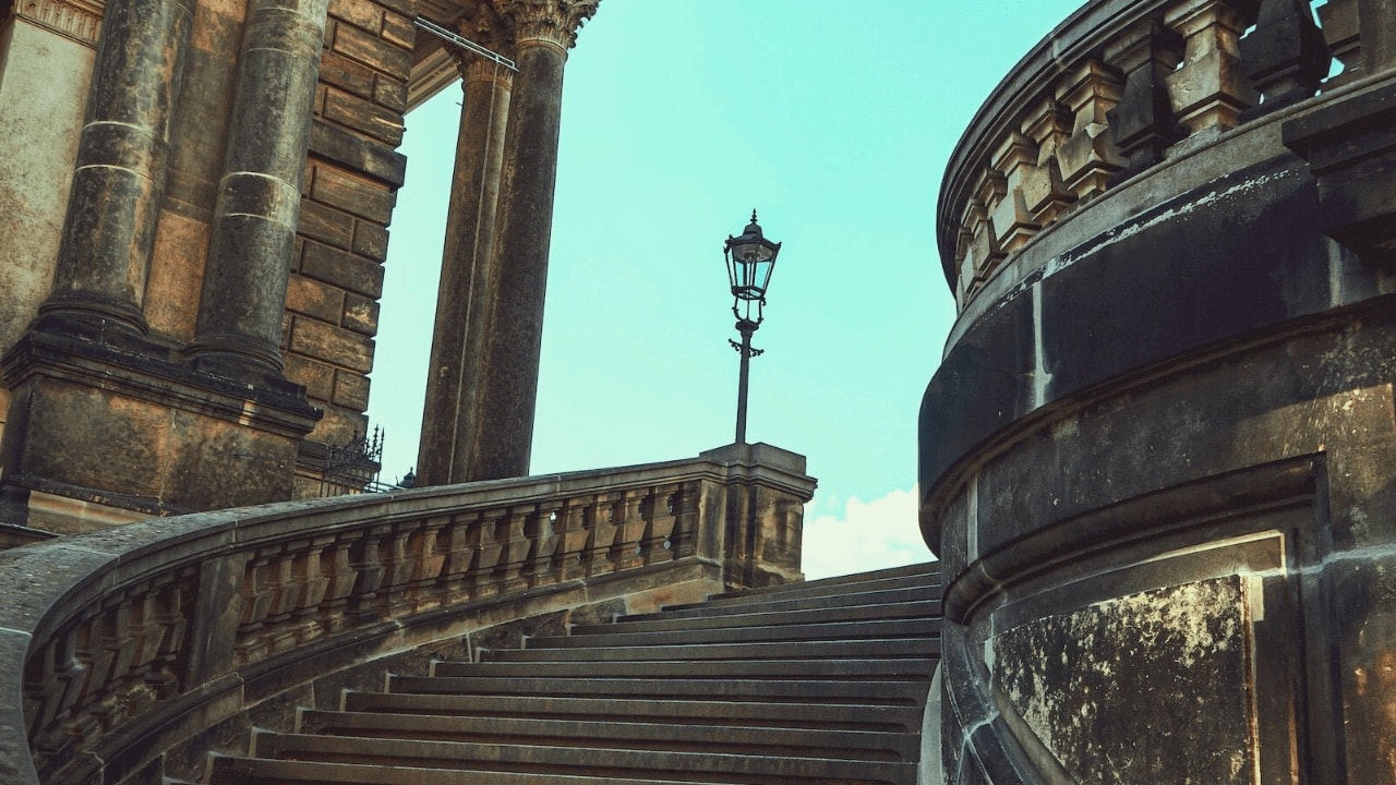 A set of stairs in an outdoor, classical monument.