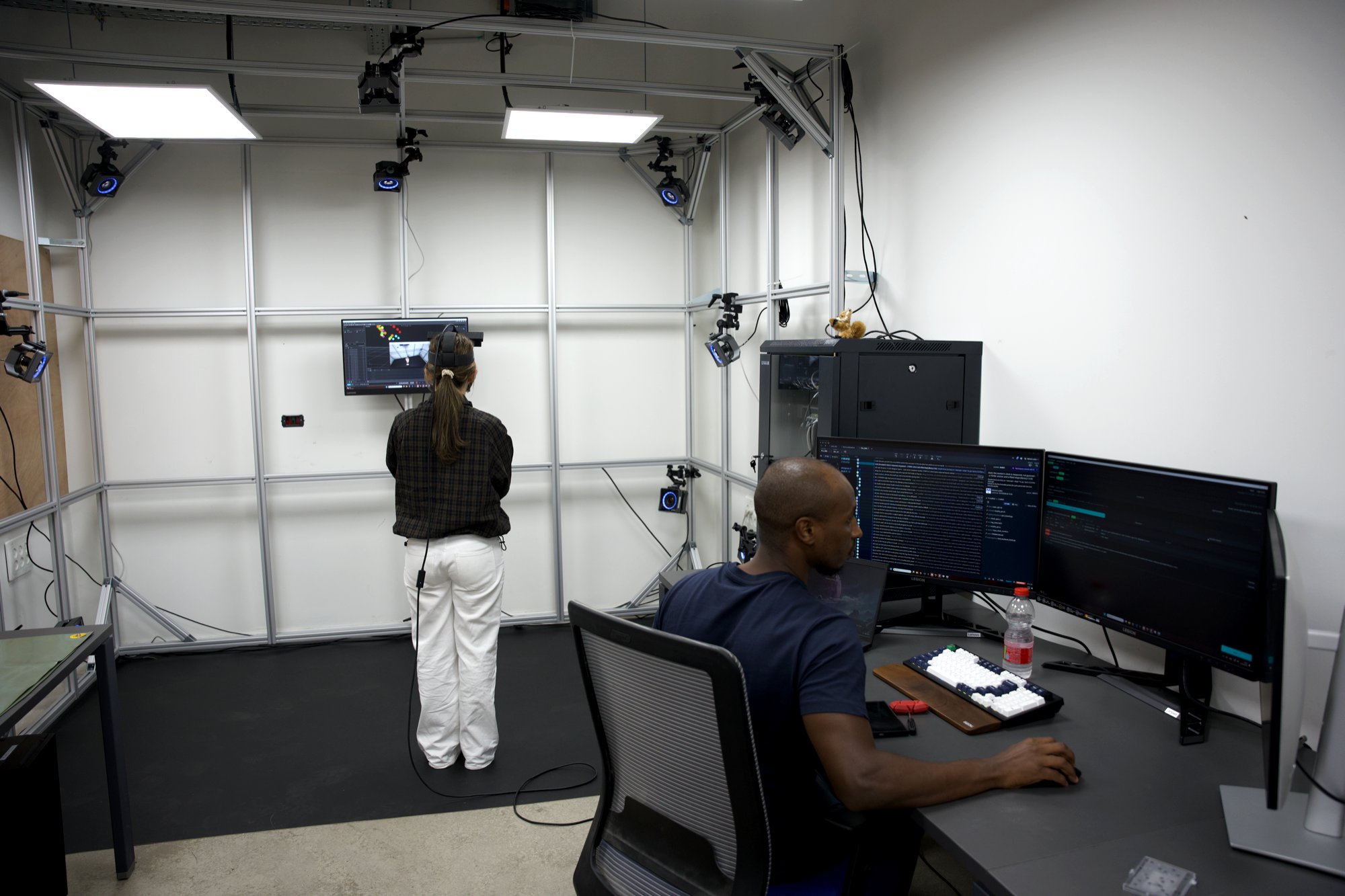 A participant recorded in the capture volume while an operator runs the session