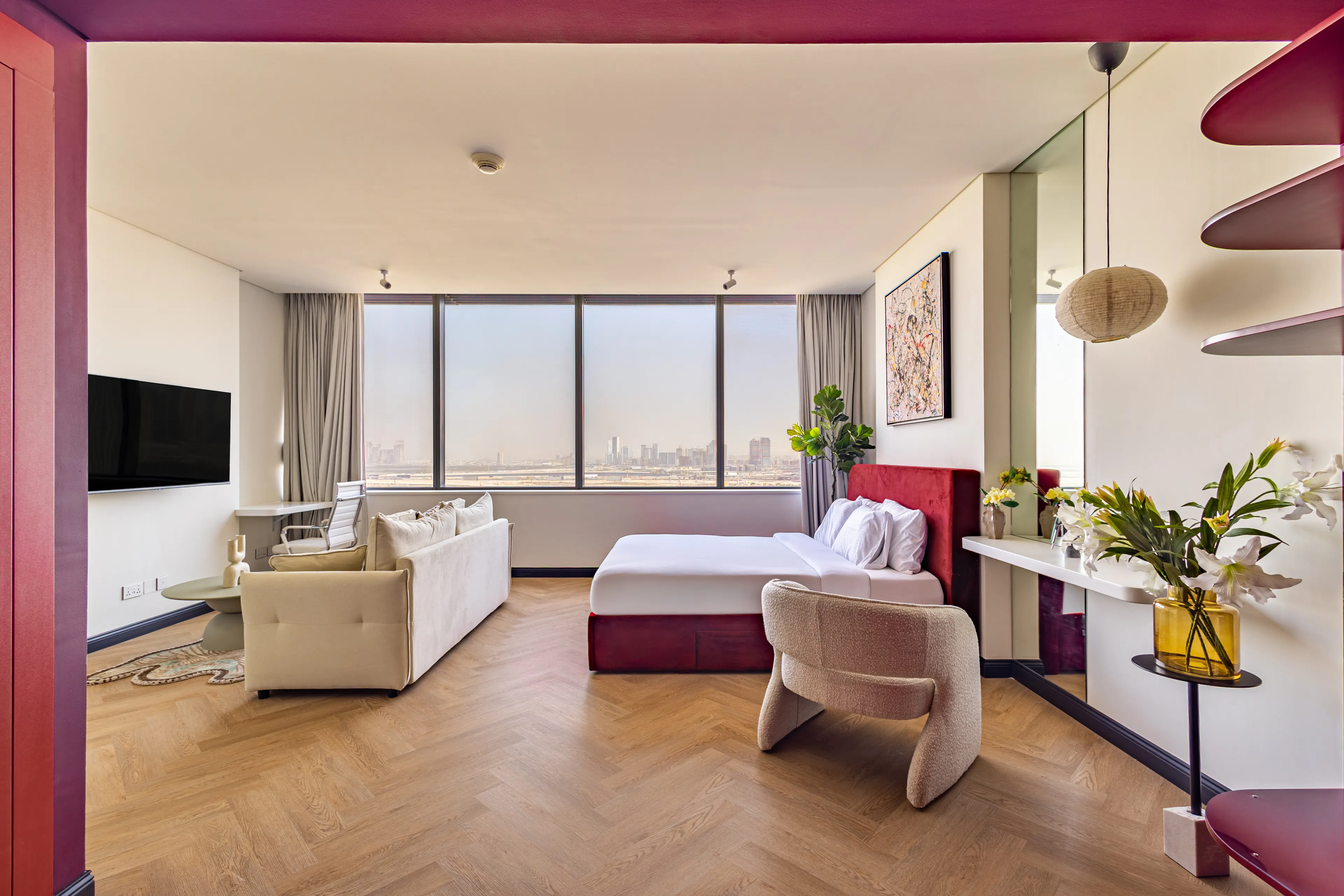 Red accents bedroom with a huge window.