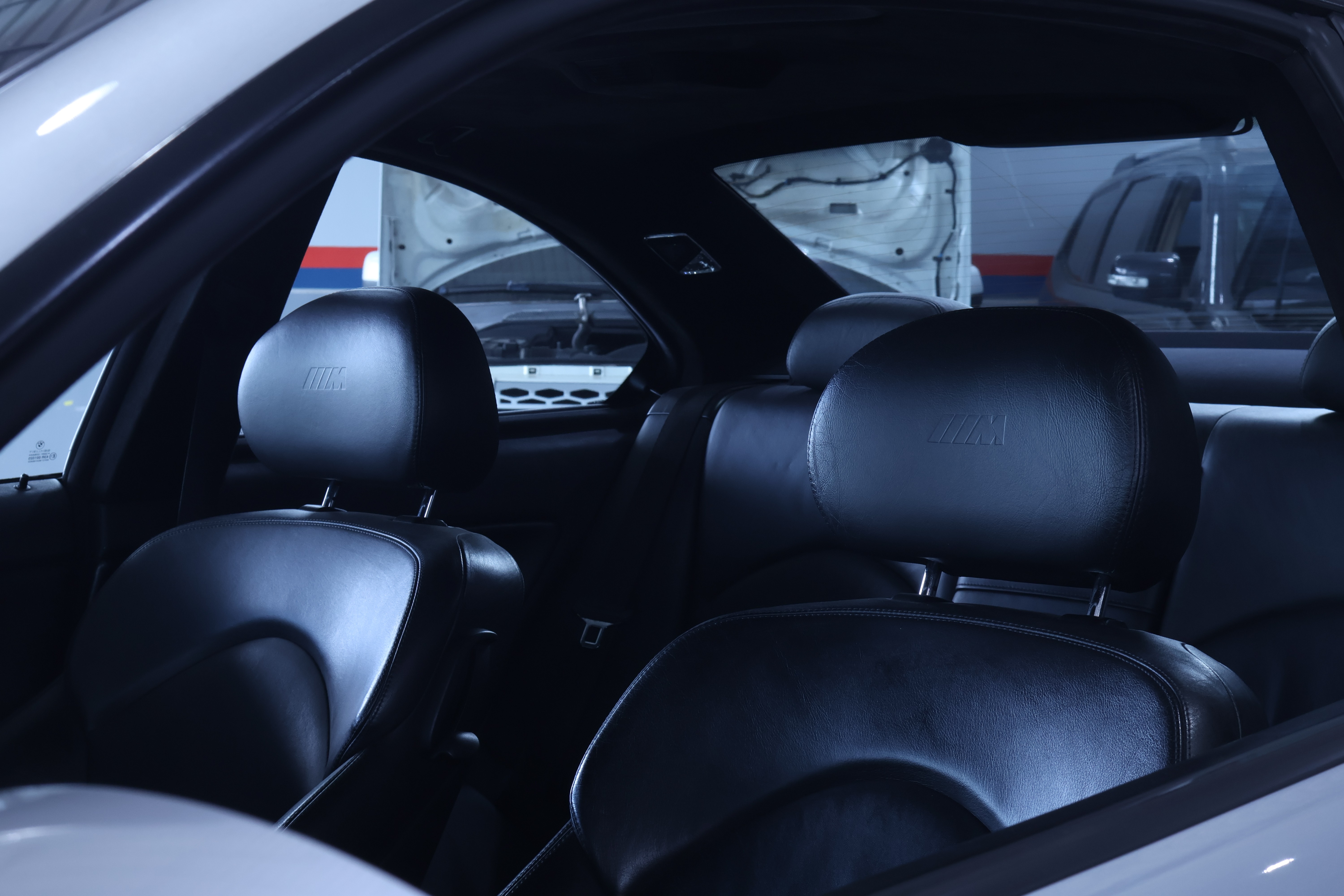 Dark luxurious interior of a car, perfect for showcasing premium car rental experiences.