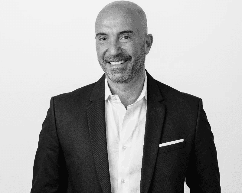 group of people sitting on chair in front of table with laptop computers