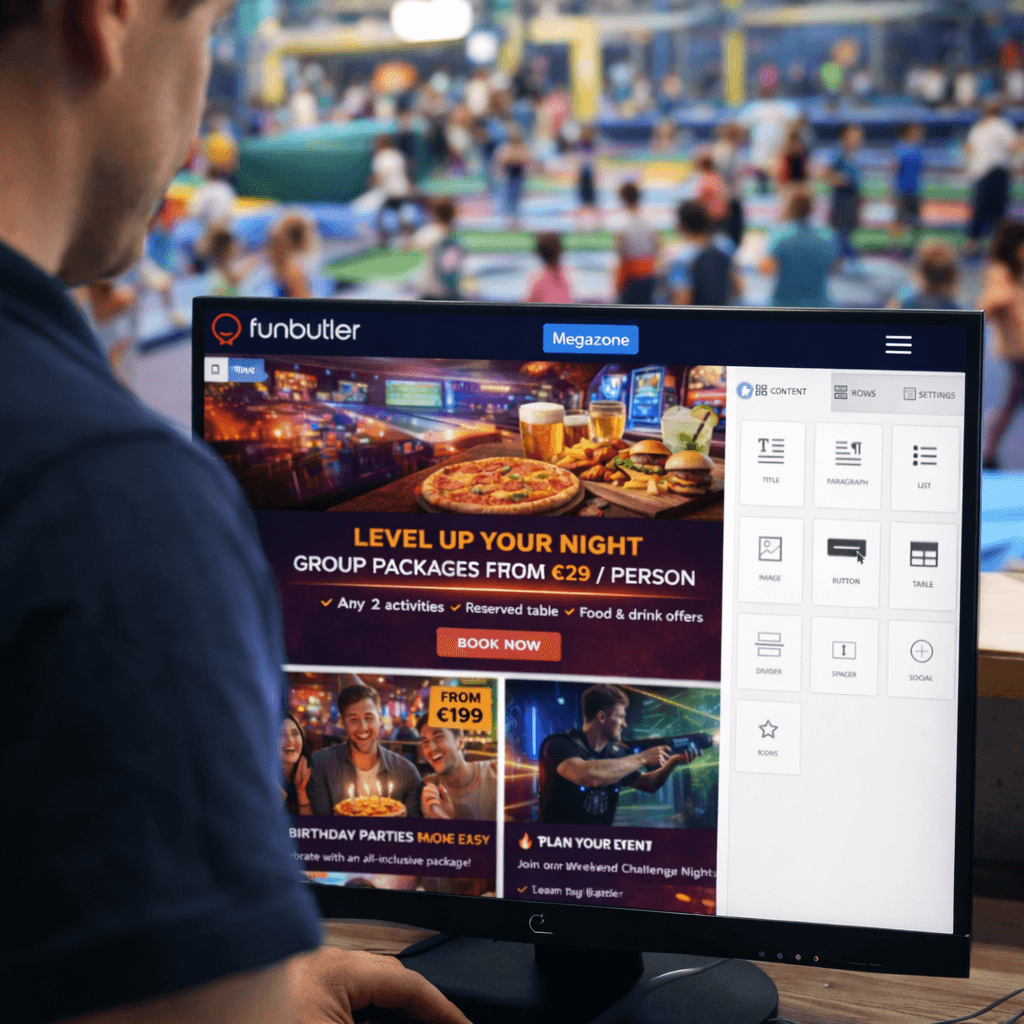 A young person with curly hair smiles at the camera while sitting in front of a laptop against a dark background.
