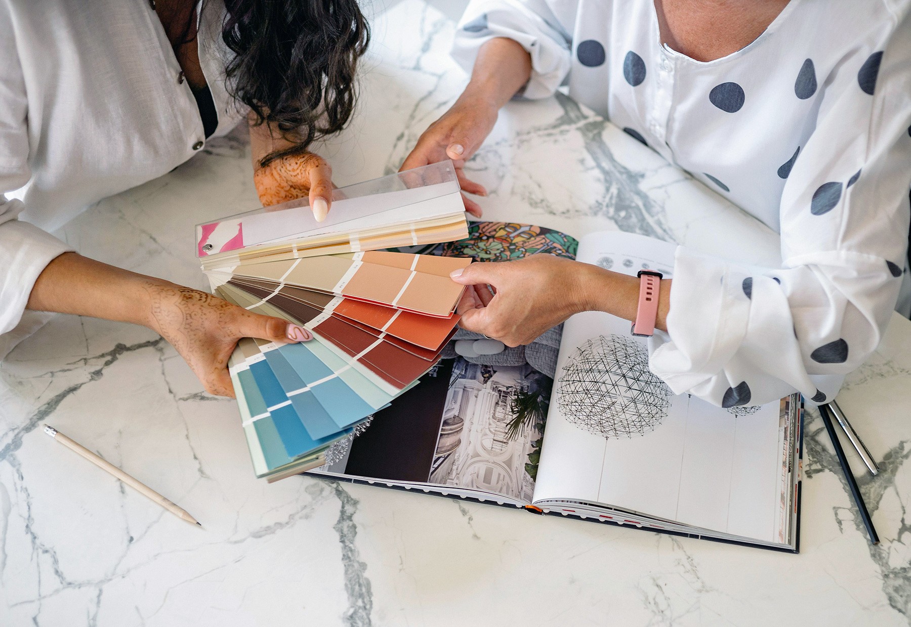 Women holding a sample color chart