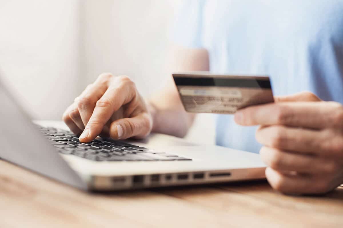 Online shopper holding a credit card