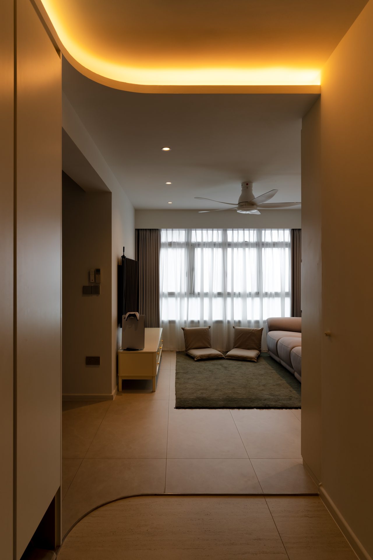 Large format tiles from johor travertine at foyer and cool grey at living