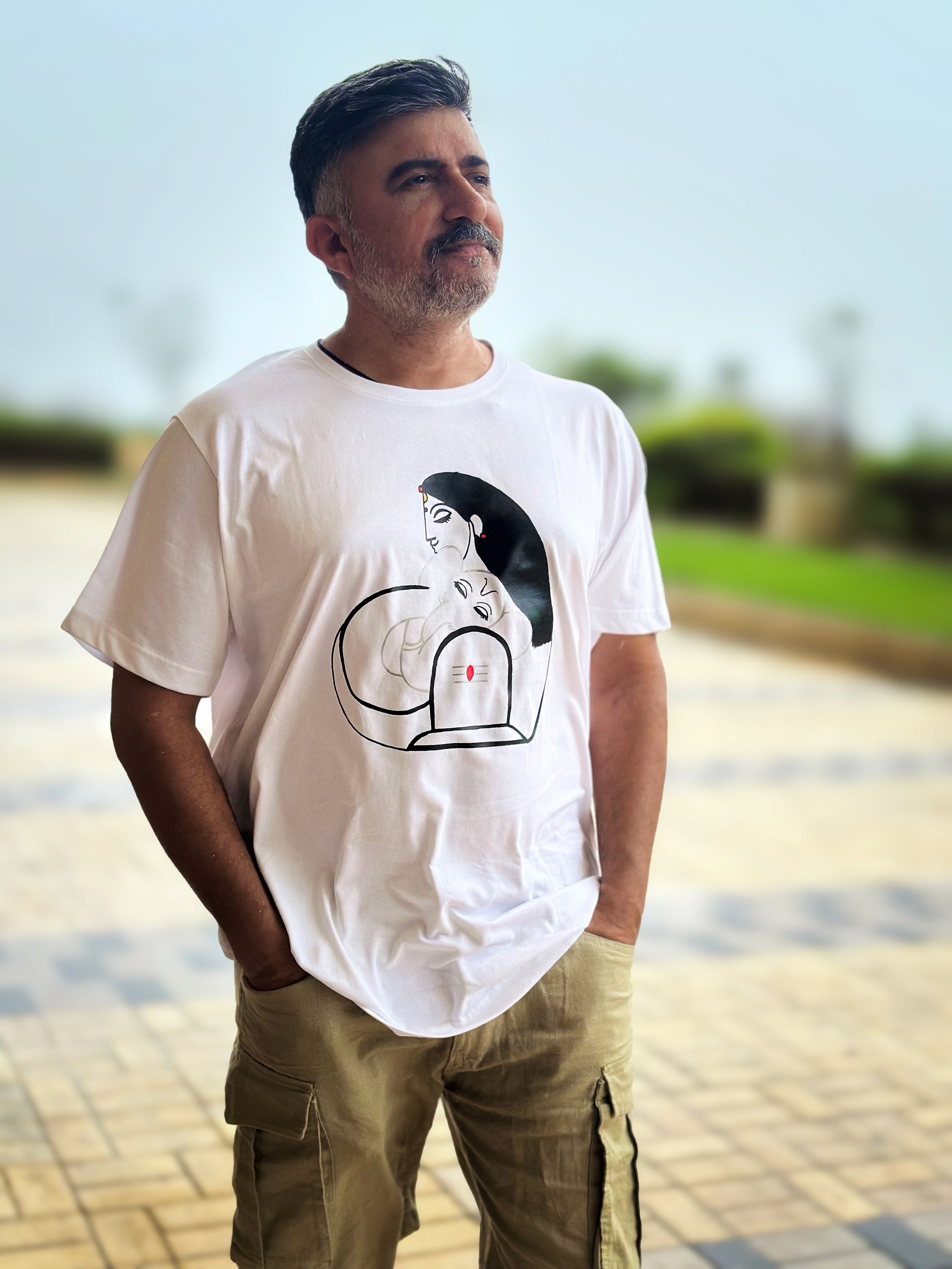 Young man in black leather double-breasted jacket jeans stand by white wall