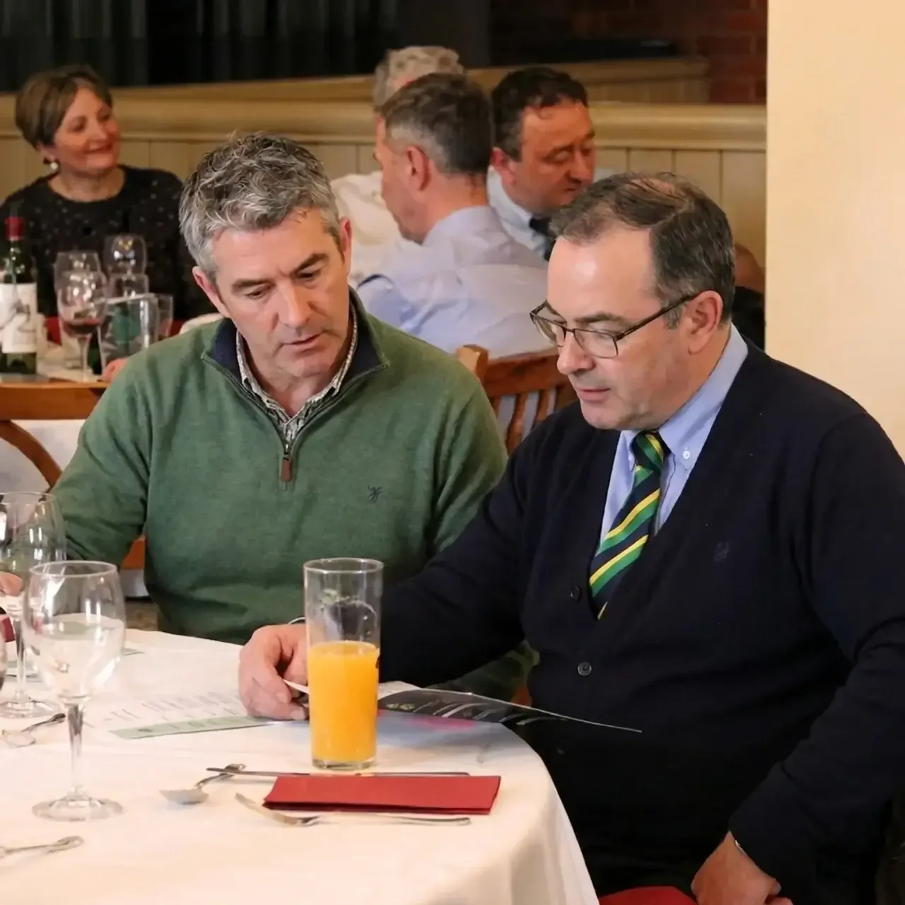 Two men eating at Mingleo dinner