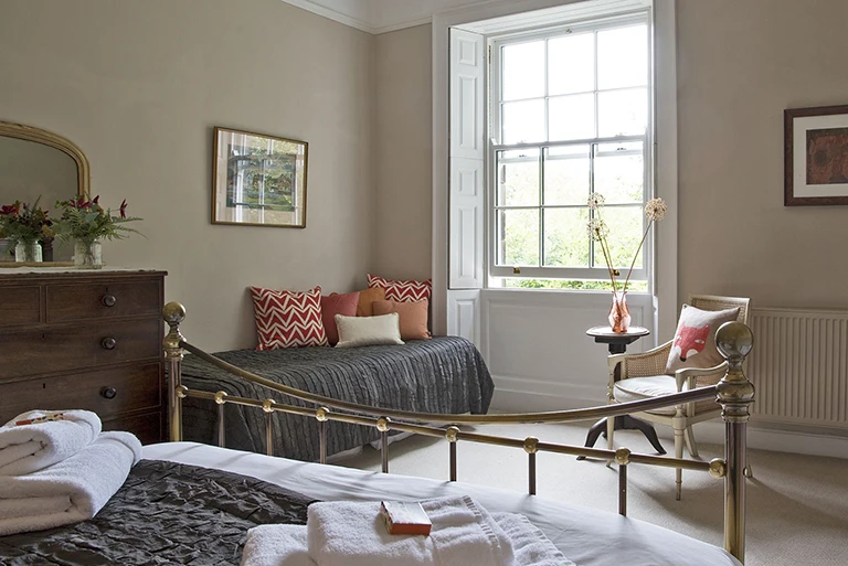 Hartingtons Heritage Tours hotel, Darley House, bedroom with metal framed bed