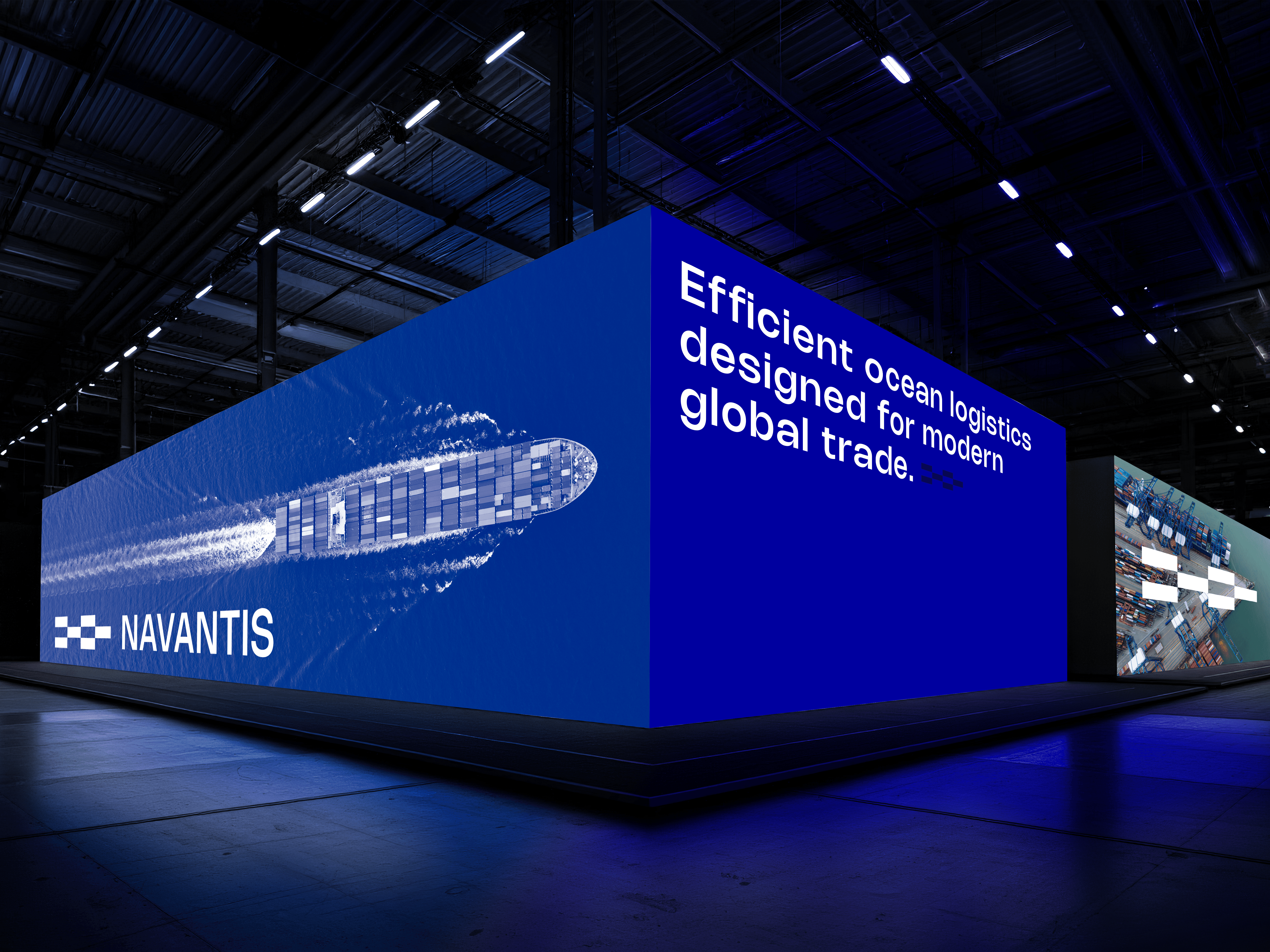 Navantis exhibition booth with a cargo ship graphic, showing how brand environments extend identity at events.