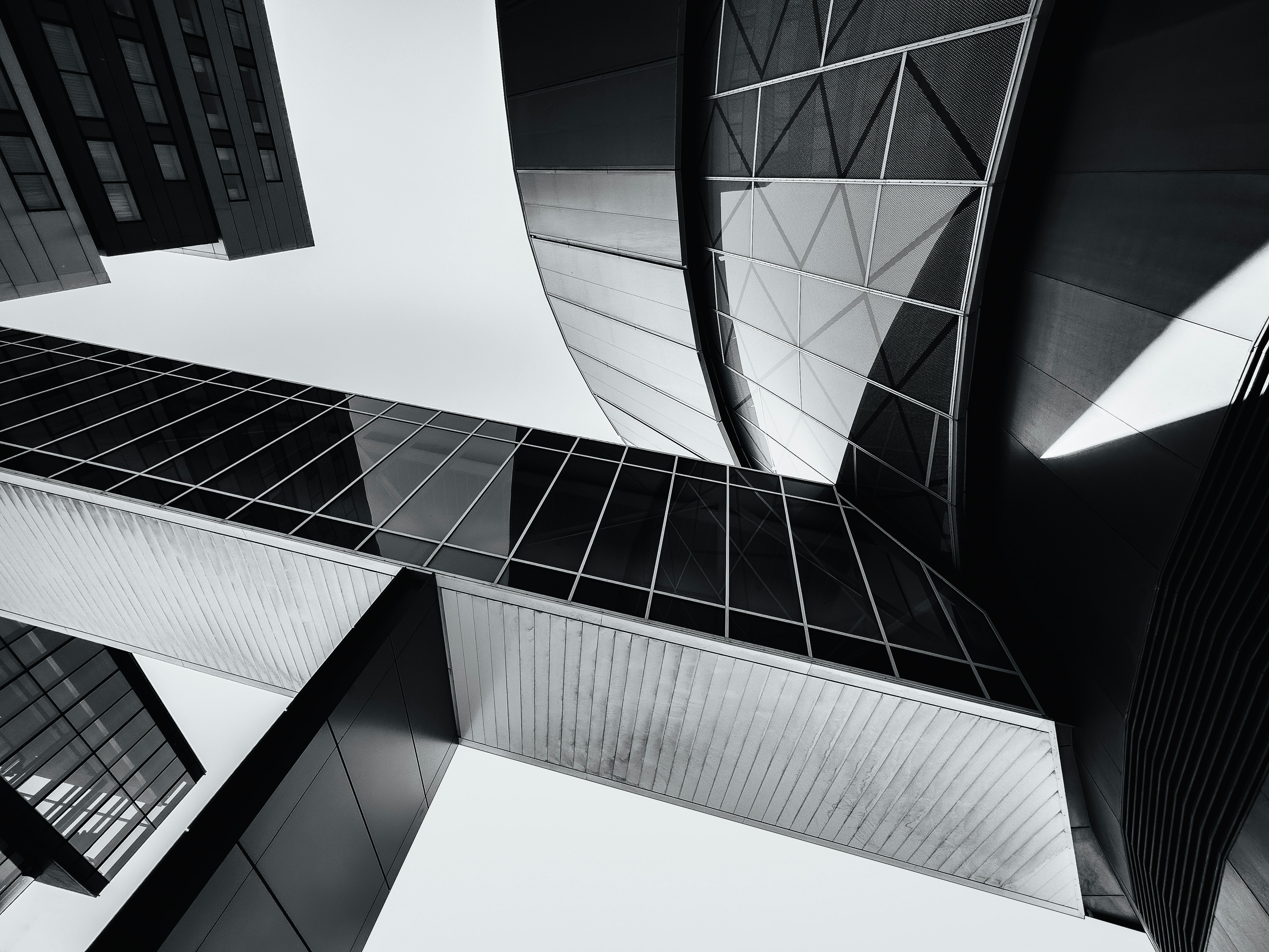 a black and white photo of tall buildings