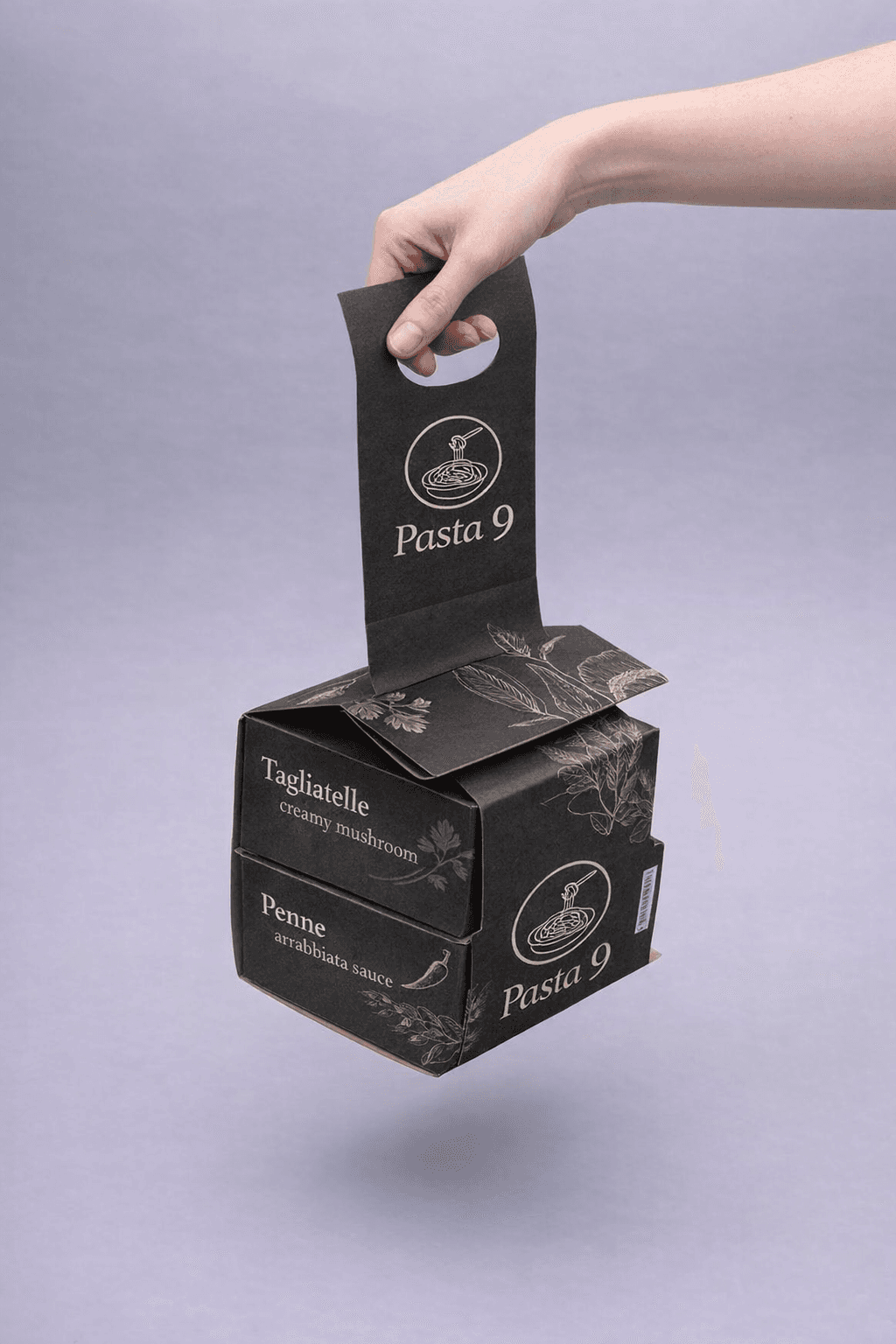 Black Pasta 9 takeaway packaging from Central Kitchen featuring stacked pasta boxes with branded carry handle, showcasing premium Italian pasta delivery in Toronto.