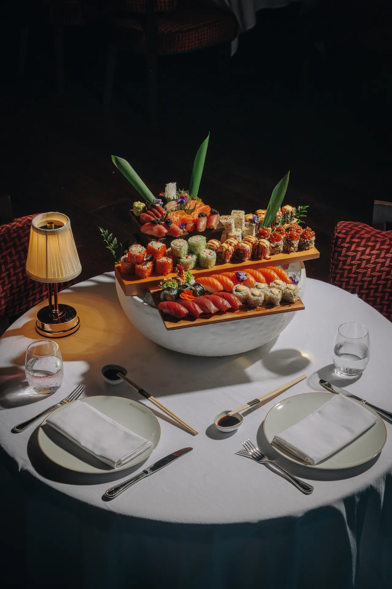 Sushi tower served at a candlelit table at Billionaire Dubai