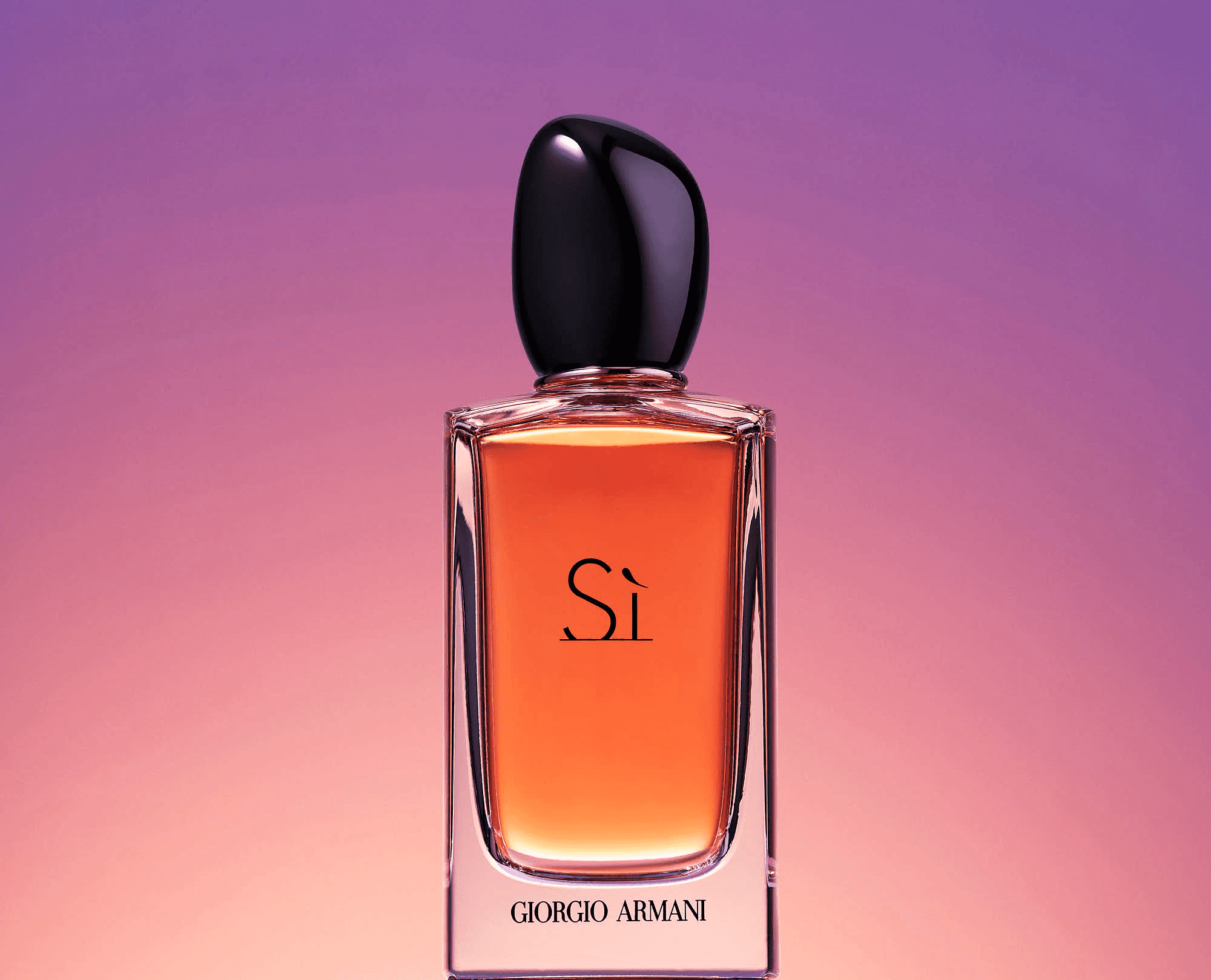 A stylish perfume bottle with a black cap, set against a soft purple background with a gradient effect.