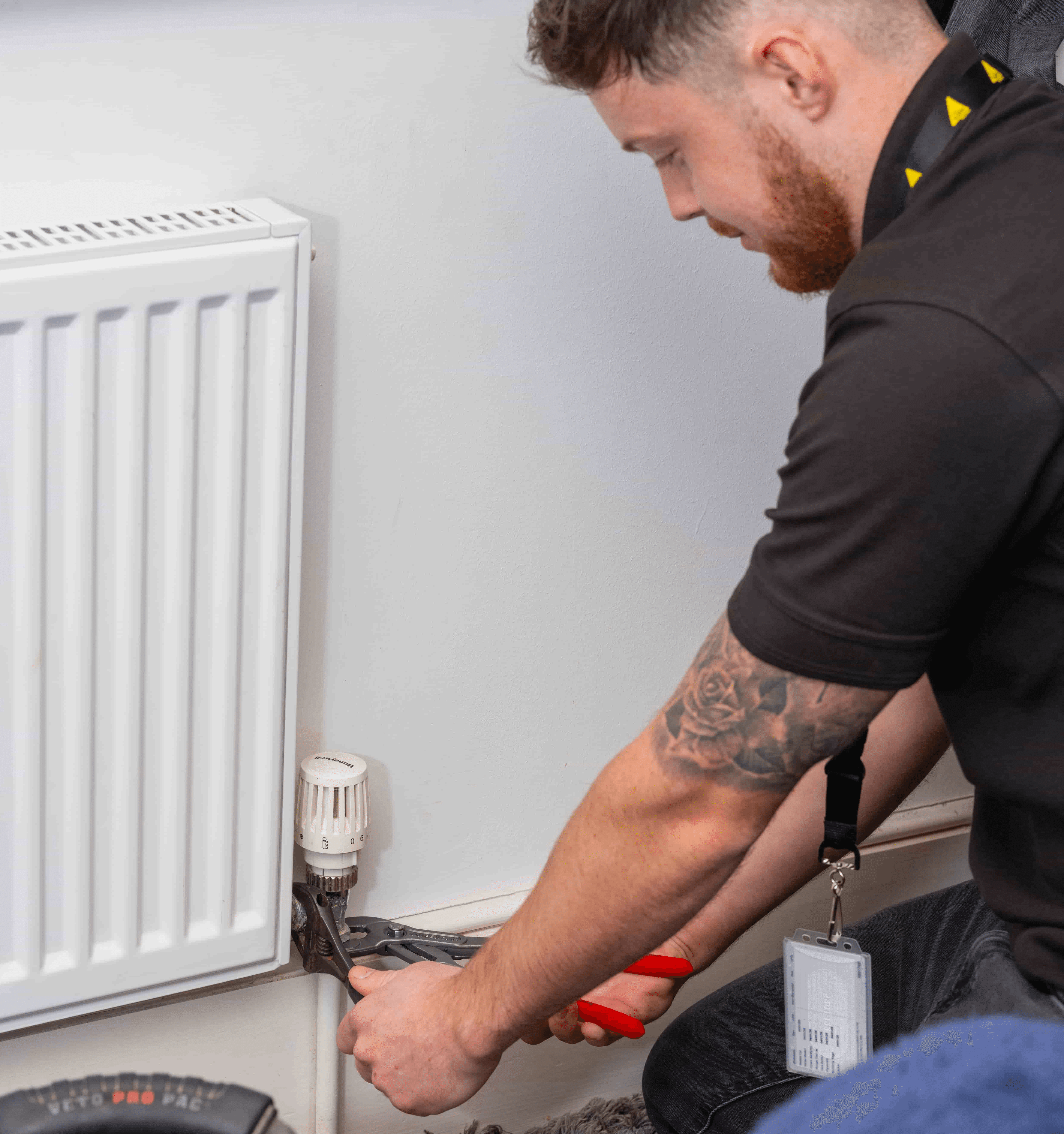 Gas safe registered engineer installing central heating system in north london