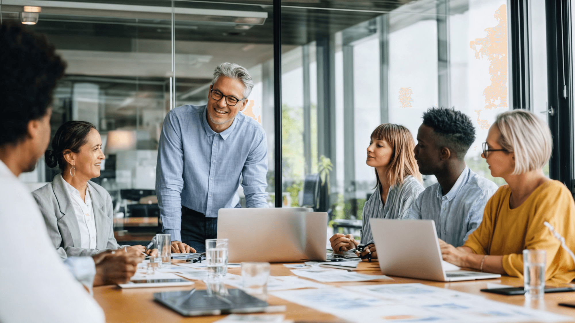 Group of people relaxing outdoors on a field or lawn