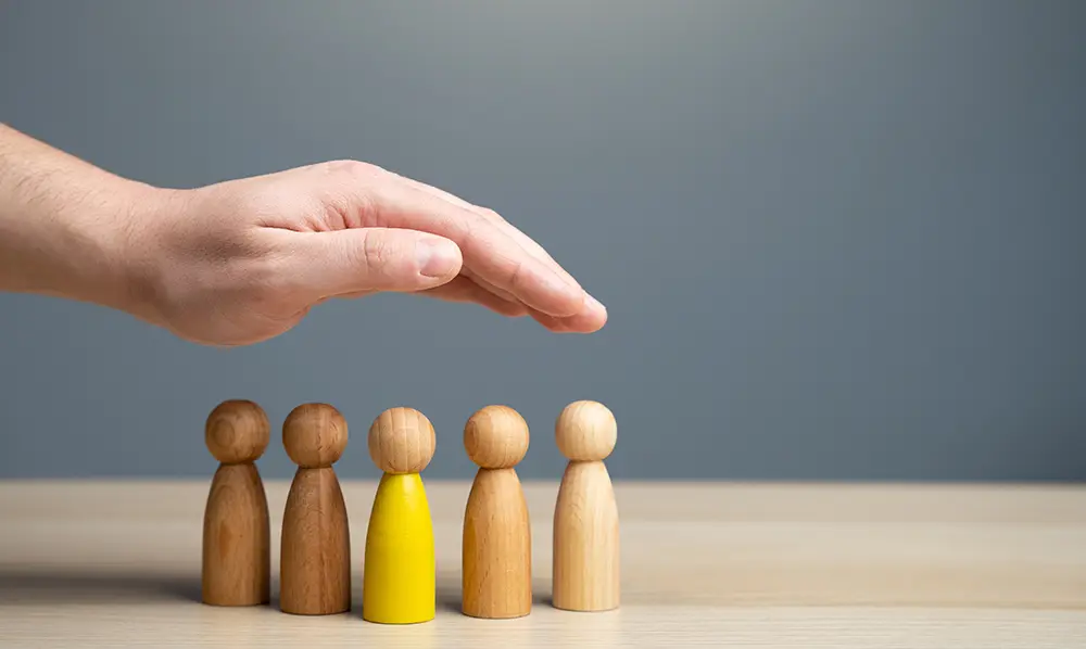 Financial adviser discussing insurance and risk protection options with clients