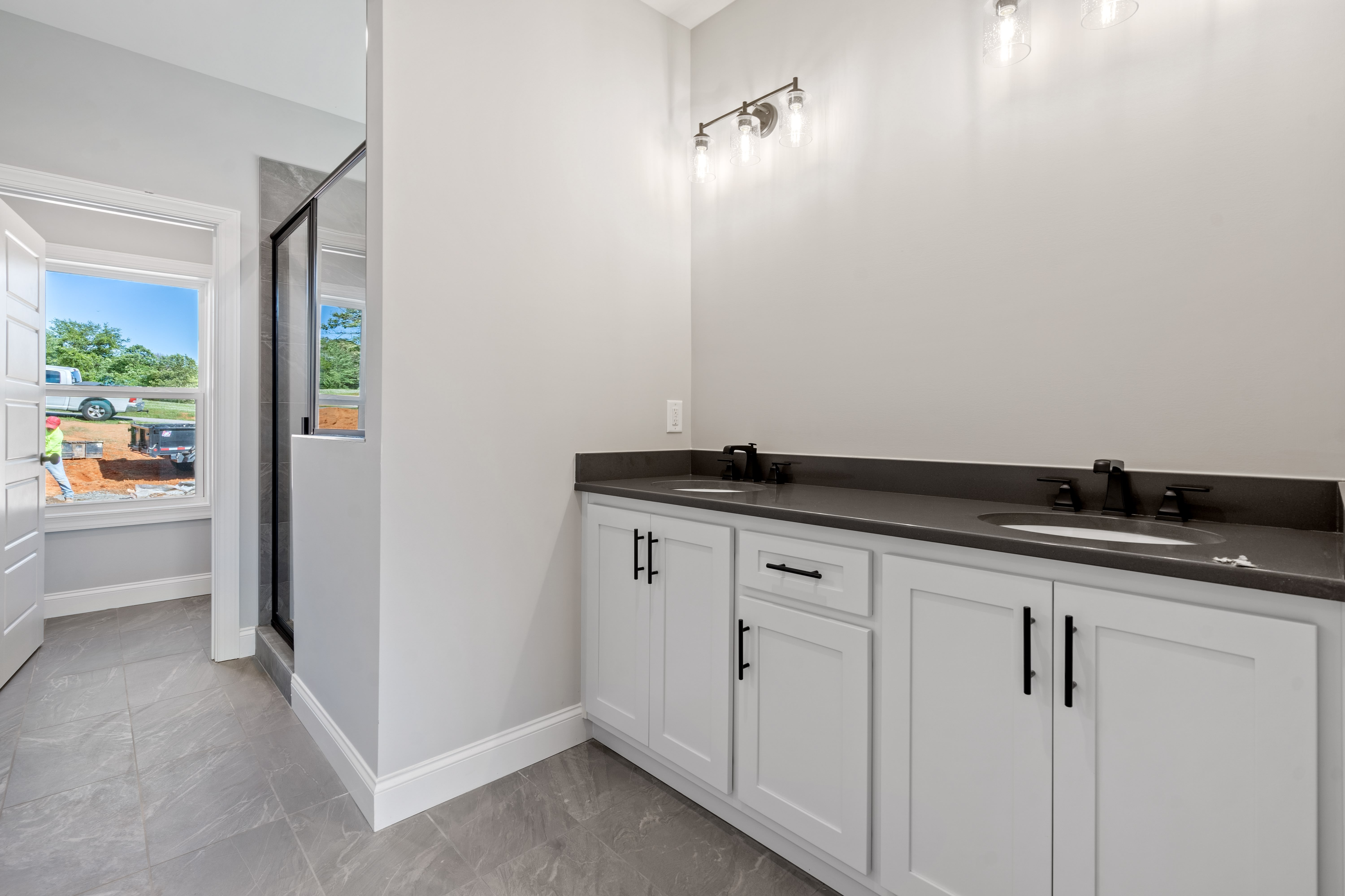 Spacious living room with vaulted ceilings and hardwood floors