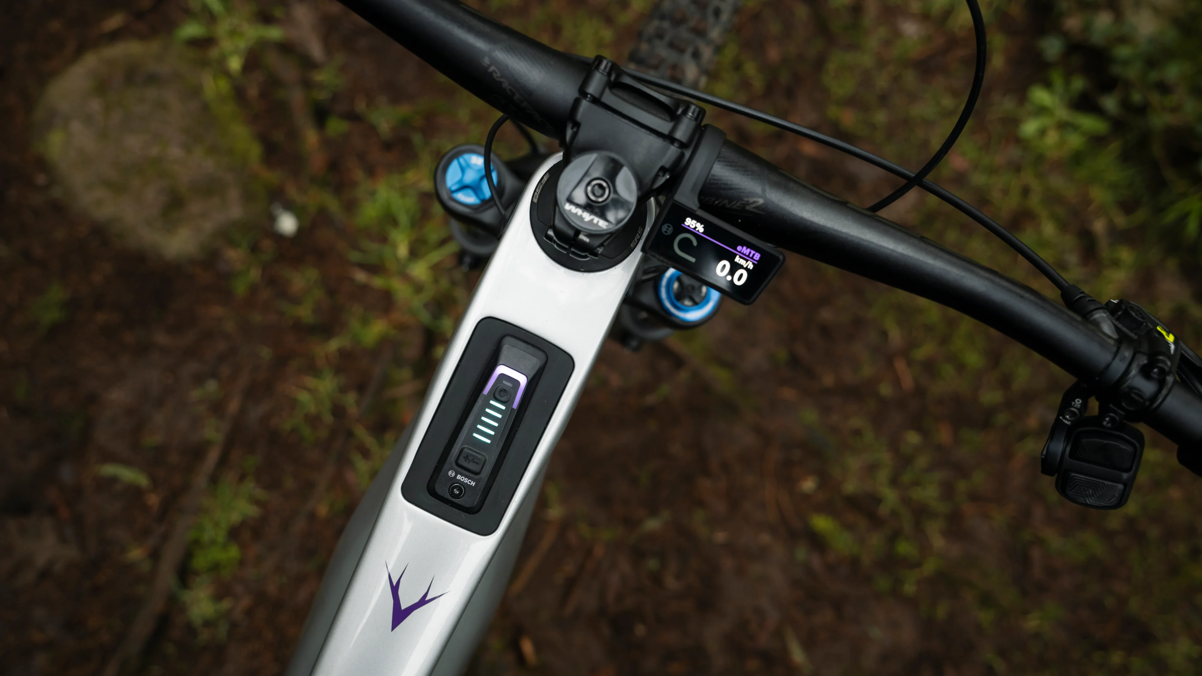 Cockpit view showing the Whyte Kado's integrated top-tube display and rider control interface.