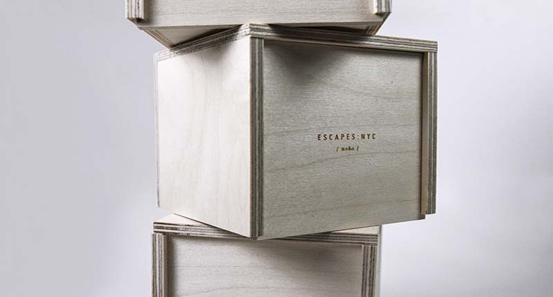 A photo of three wooden boxes stacked one on top of the other.