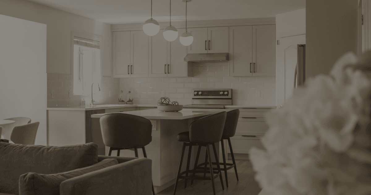 Image of flowers in front of light kitchen.