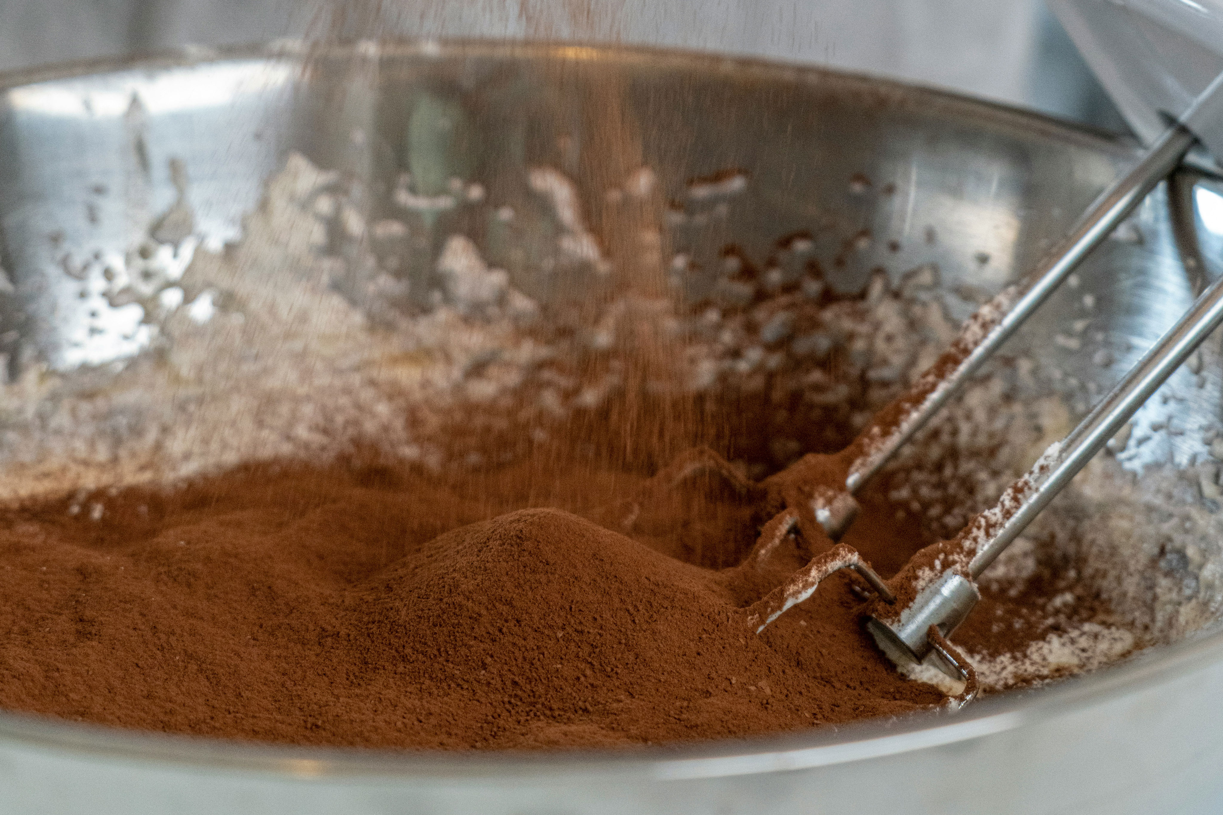 person holding silver round bowl